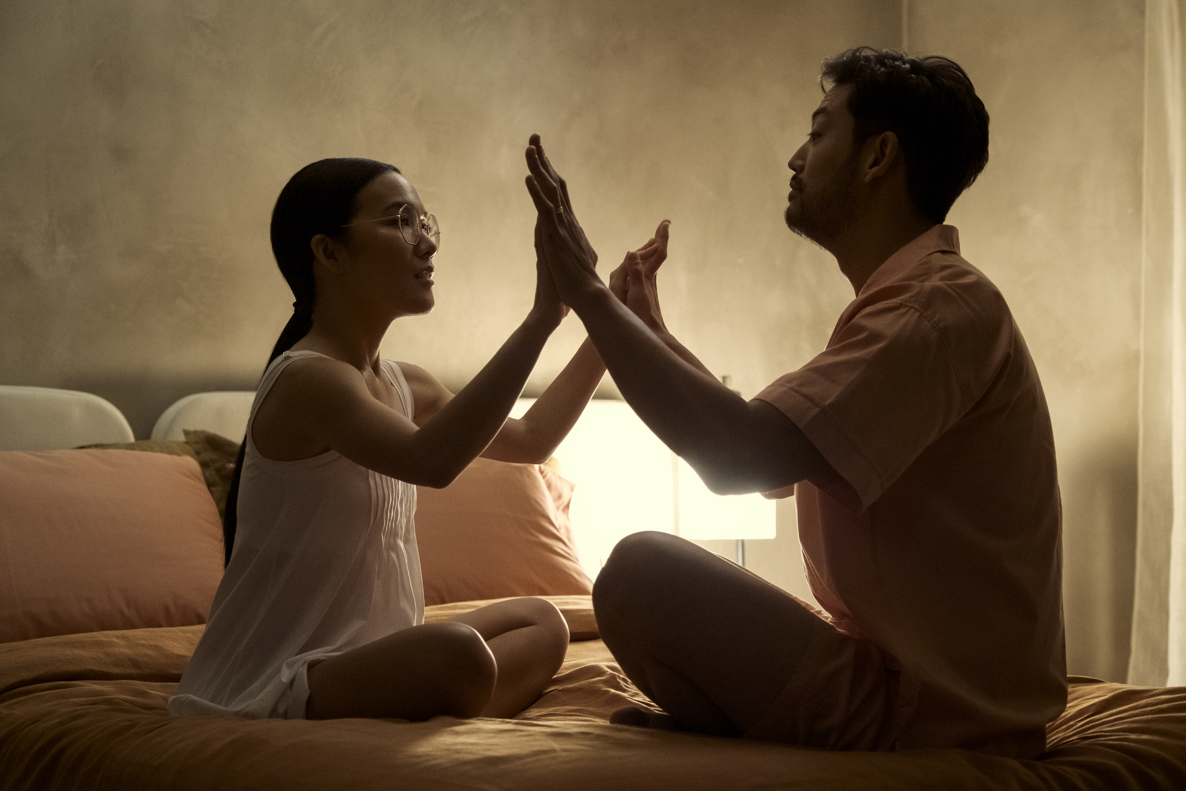 Amy (Ali Wong) and her husband, George (Joseph Lee) attempt an intimacy exercise. (Andrew Cooper—Netflix)