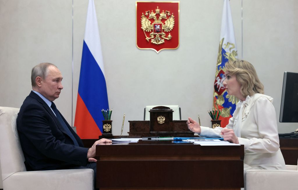 Russian President Vladimir Putin meets with Maria Lvova-Belova, Russian children's rights commissioner, at the Novo-Ogaryovo state residence, outside Moscow, on February 16, 2023. (Mikhail Metzel—Sputnik/AFP/Getty Images)