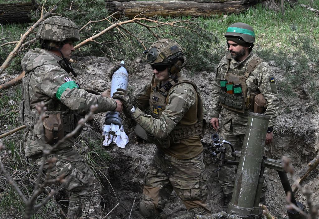 Ukrainian servicemen of the 95th Separate Air Assault Brigade prepare to fire a 120mm mortar towards Russian positions on a frontline in Donetsk region, on April 5, 2023. (Genya Savilov—AFP/Getty Images)