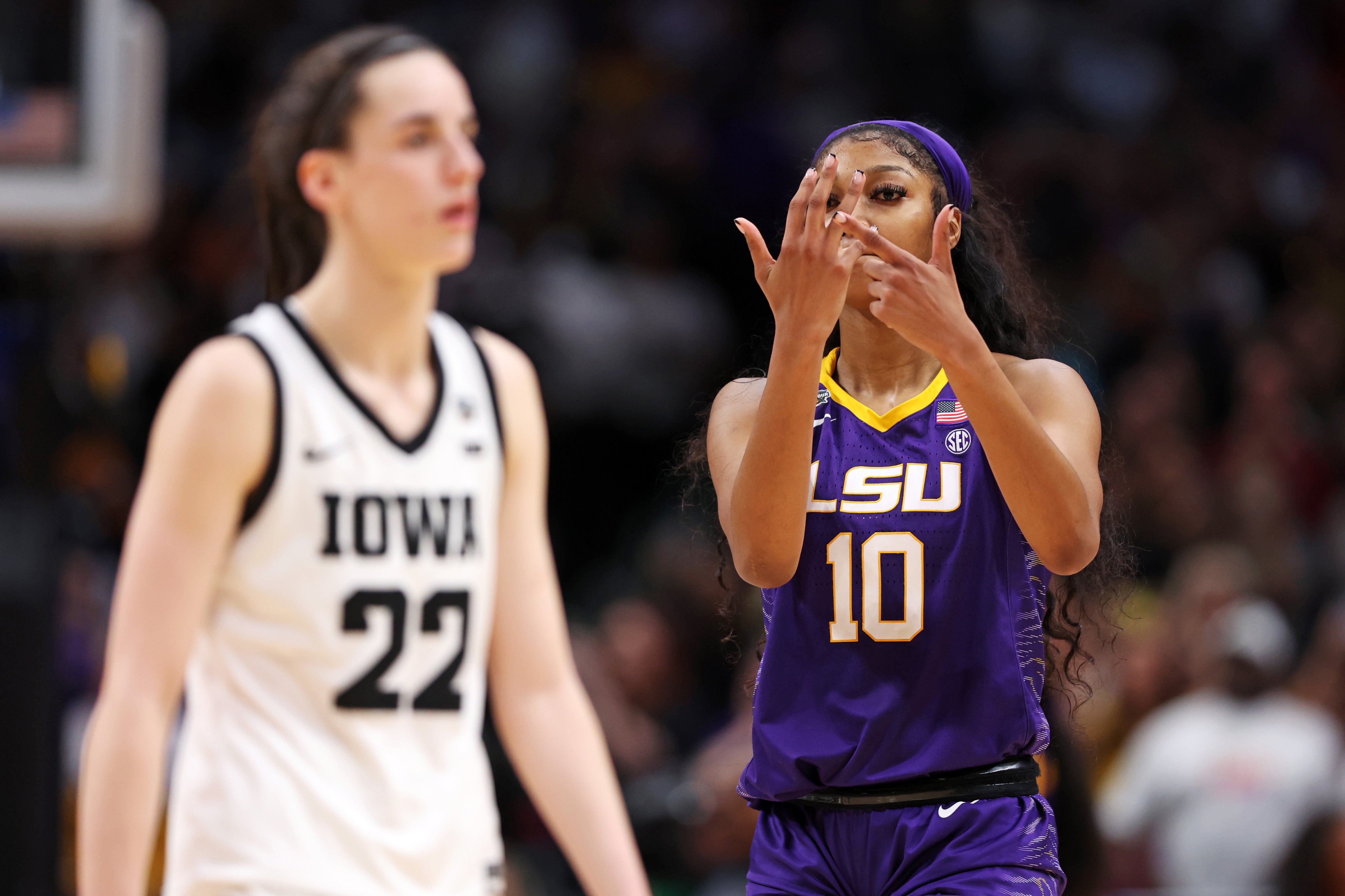 Angel Reese of the LSU Lady Tigers reacts towards Caitlin Clarkof the Iowa Hawkeyes during the fourth quarter during the 2023 NCAA Women’s Basketball Tournament championship game at American Airlines Center in Dallas on April 2, 2023. (Maddie Meyer—Getty Images)