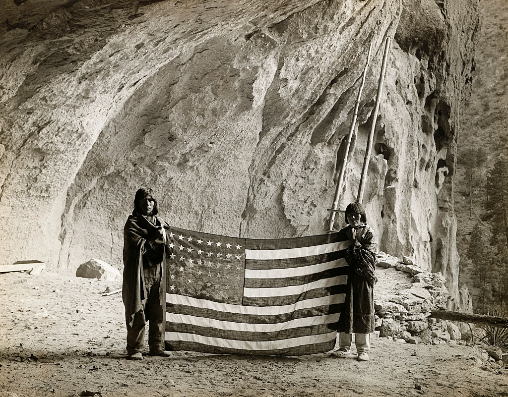 Pueblo Indigenous people at the Ceremonial Cave of the Frijoles Canyon in New Mexico. (George Rinhart—Corbis/Getty Images)