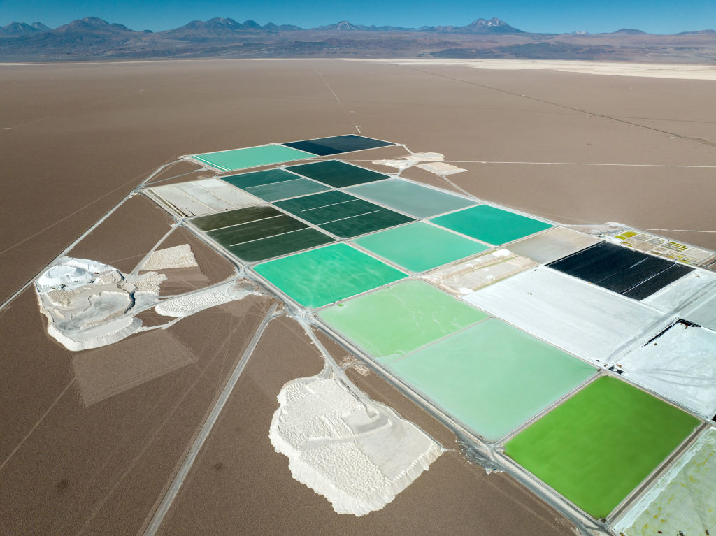 Pools of brine containing lithium carbonate and mounds of salt bi-product stretch through Albemarle's lithium mine in the Atacama Desert on August 24, 2022 in Salar de Atacama, Chile. (John Moore—Getty Images)