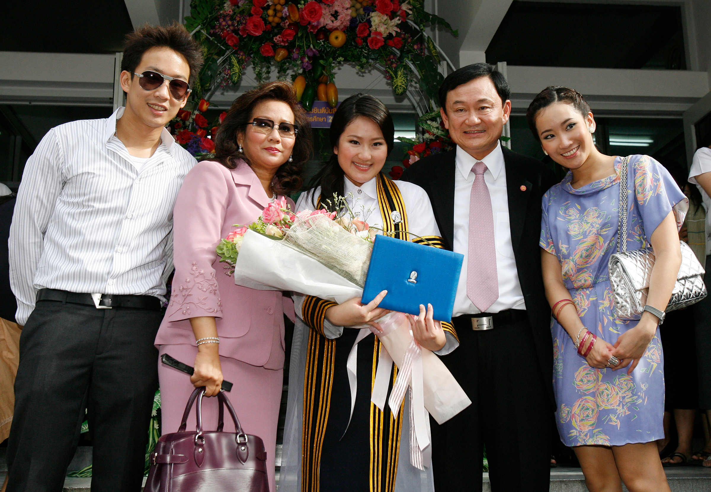 Paetongtarn Shinawatra, center, at her graduation day with her family—including ousted Thai prime minister Thaksin Shinawatra—at Chulalongkorn University in Bangkok on July 10, 2008. (Chaiwat Subprasom—Reuters)