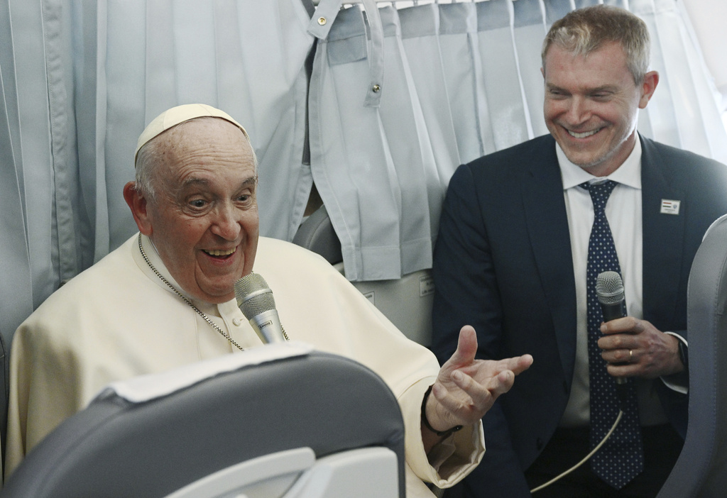 Pope Francis meets the journalists during a press conference aboard the airplane directed to Rome, at the end of his pastoral visit to Hungary, on April 30, 2023. (Vincenzo Pinto—Pool/AP)