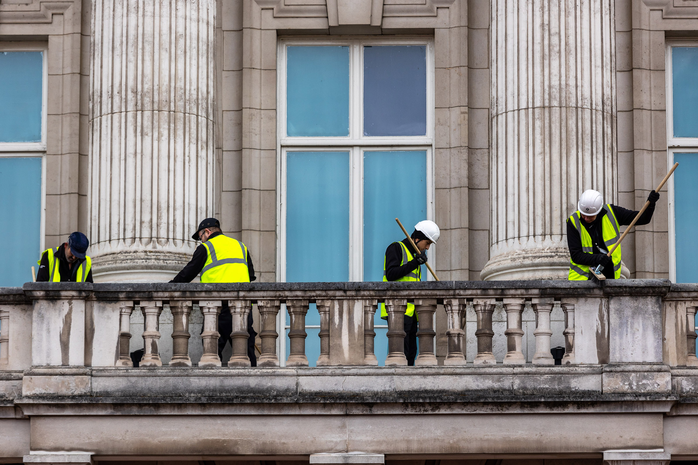 The balcony at Buckingham Palace balcony is cleaned ahead of the coronation, on April 18. (Marcin Nowak—Shutterstock)