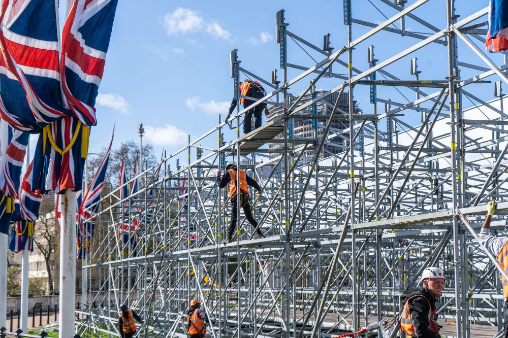 Workers build a viewing grandstand opposite Buckingham Palace on April 13.