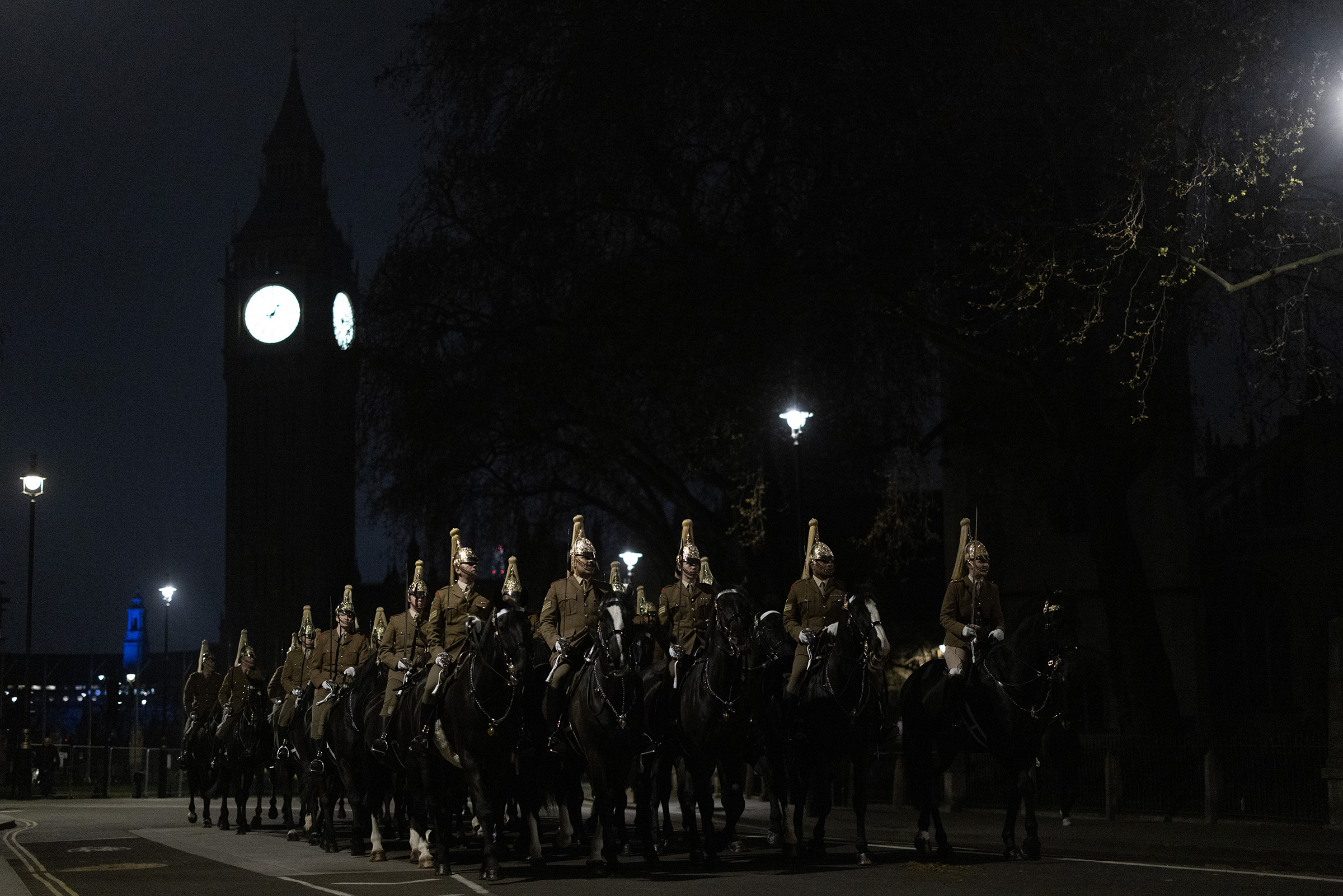 A night time rehearsal for the coronation of King Charles III passes the Houses of Parliament on April 18.