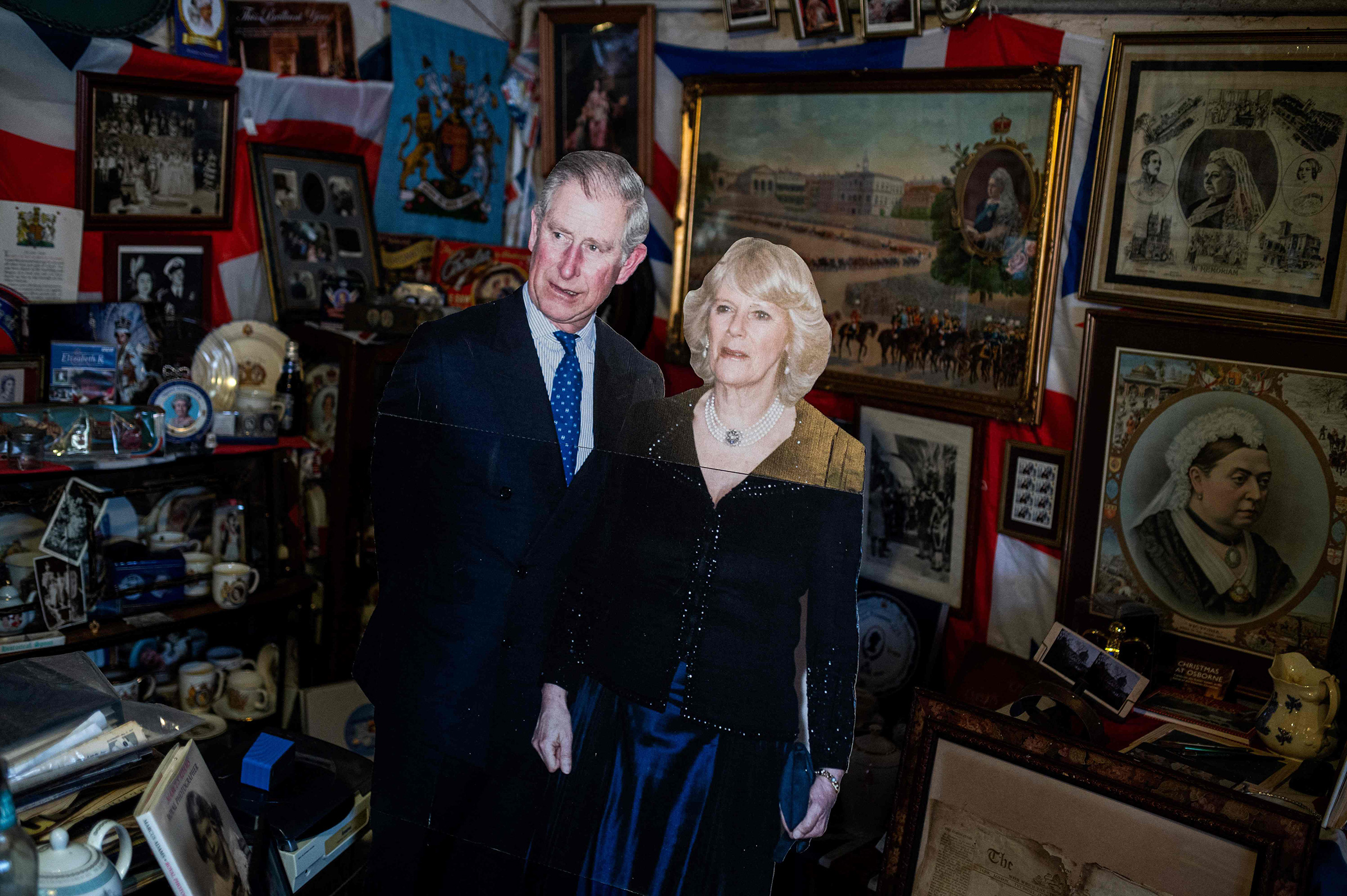A life-sized cardboard cut-out of King Charles III and Camilla, Queen Consort is displayed amongst the 13,283 pieces of royal memorabilia which ardent monarchist Anita Atkinson exhibits at her Weardale farm near Bishop Auckland, northern England on March 31. (Oli Scarff—AFP/Getty Images)
