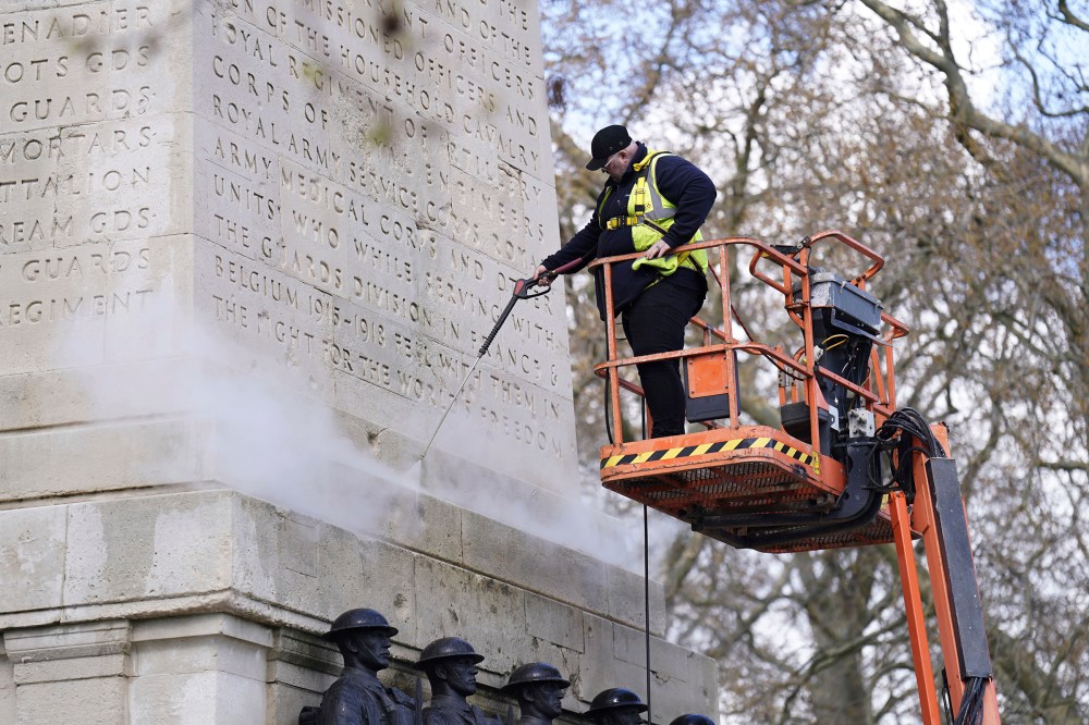 A monument is cleaned near Horse Guards Parade, London, April 13.