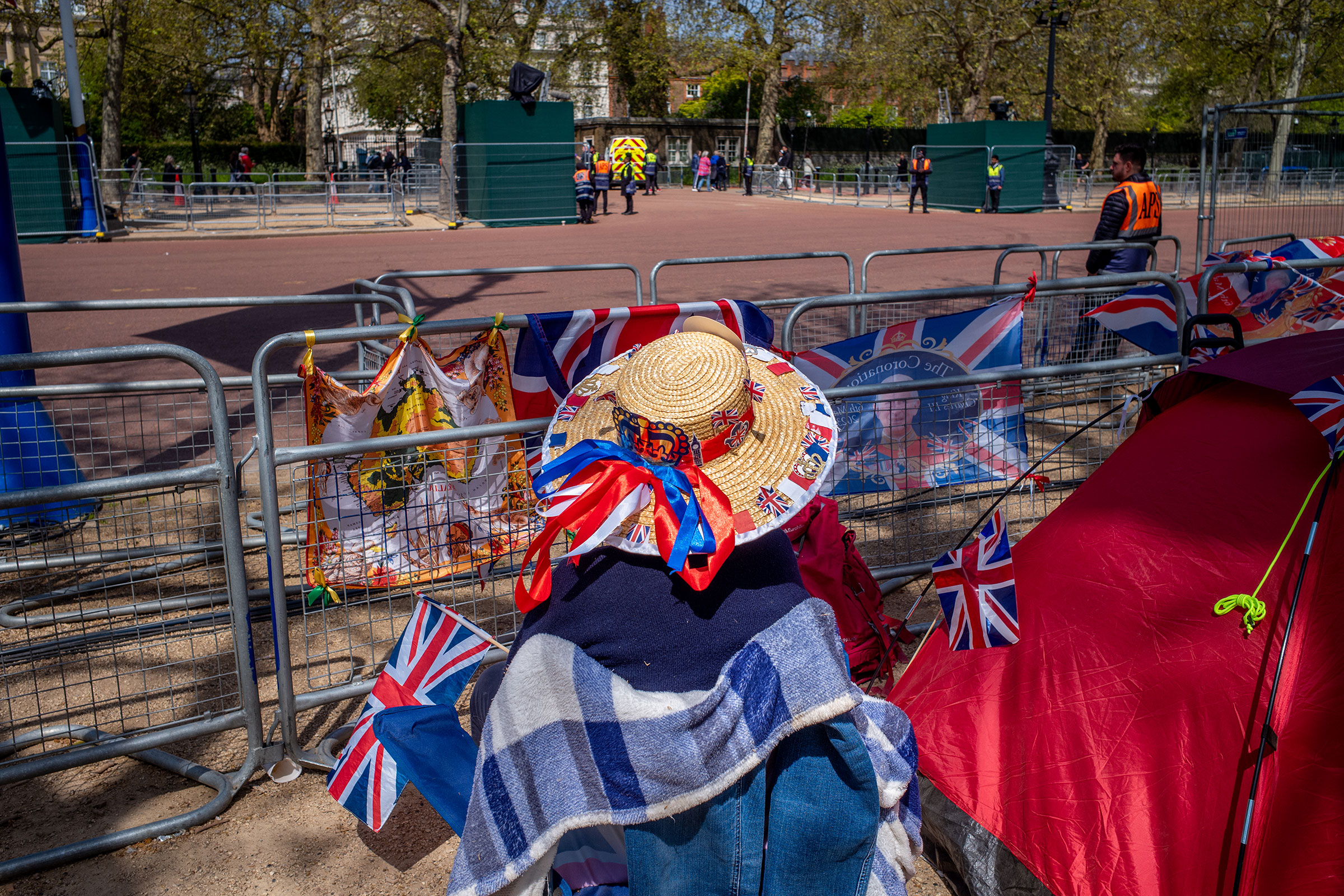 Julia Walker sits waiting along the procession line on May 3. The Coronation of King Charles III and The Queen Consort will take place on May 6.