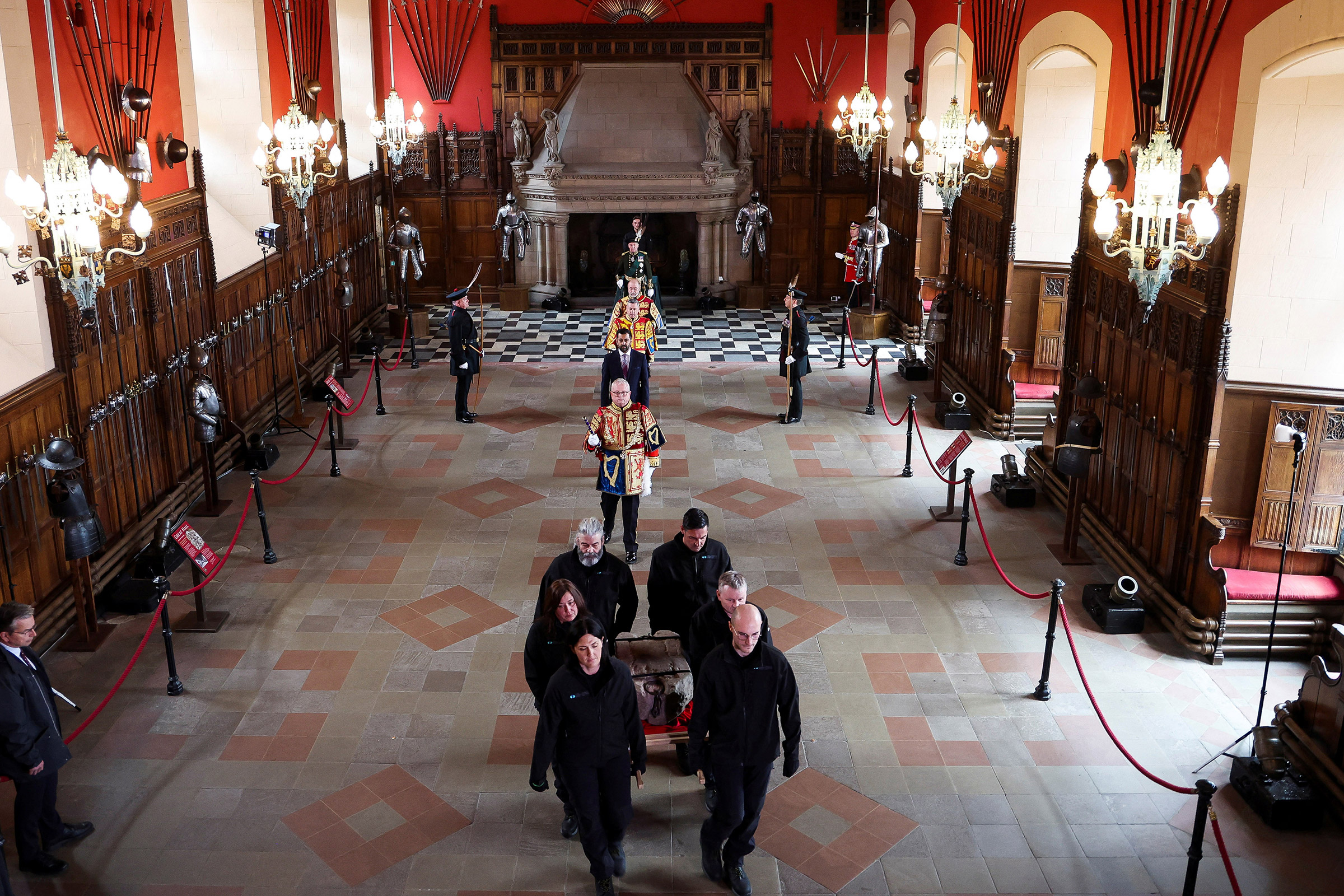 The Stone of Destiny is carried out of the Great Hall in Edinburgh Castle before onward transportation to Westminster Abbey for the Coronation of King Charles III, on April 27.
