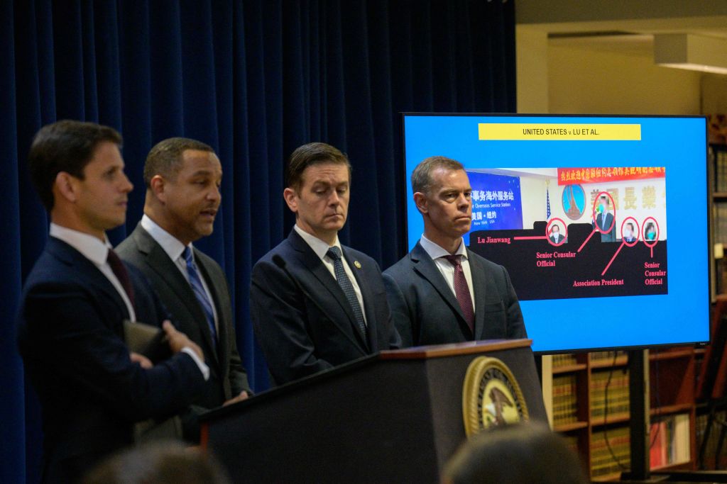 U.S. Attorney for the Eastern District of New York Breon Peace (second from left) speaks at a Justice Dept. news conference announcing arrests and charges against multiple individuals alleged to be working illegally in connection with the Chinese government, in New York City on April 17, 2023. (Angela Weiss—AFP/Getty Images)