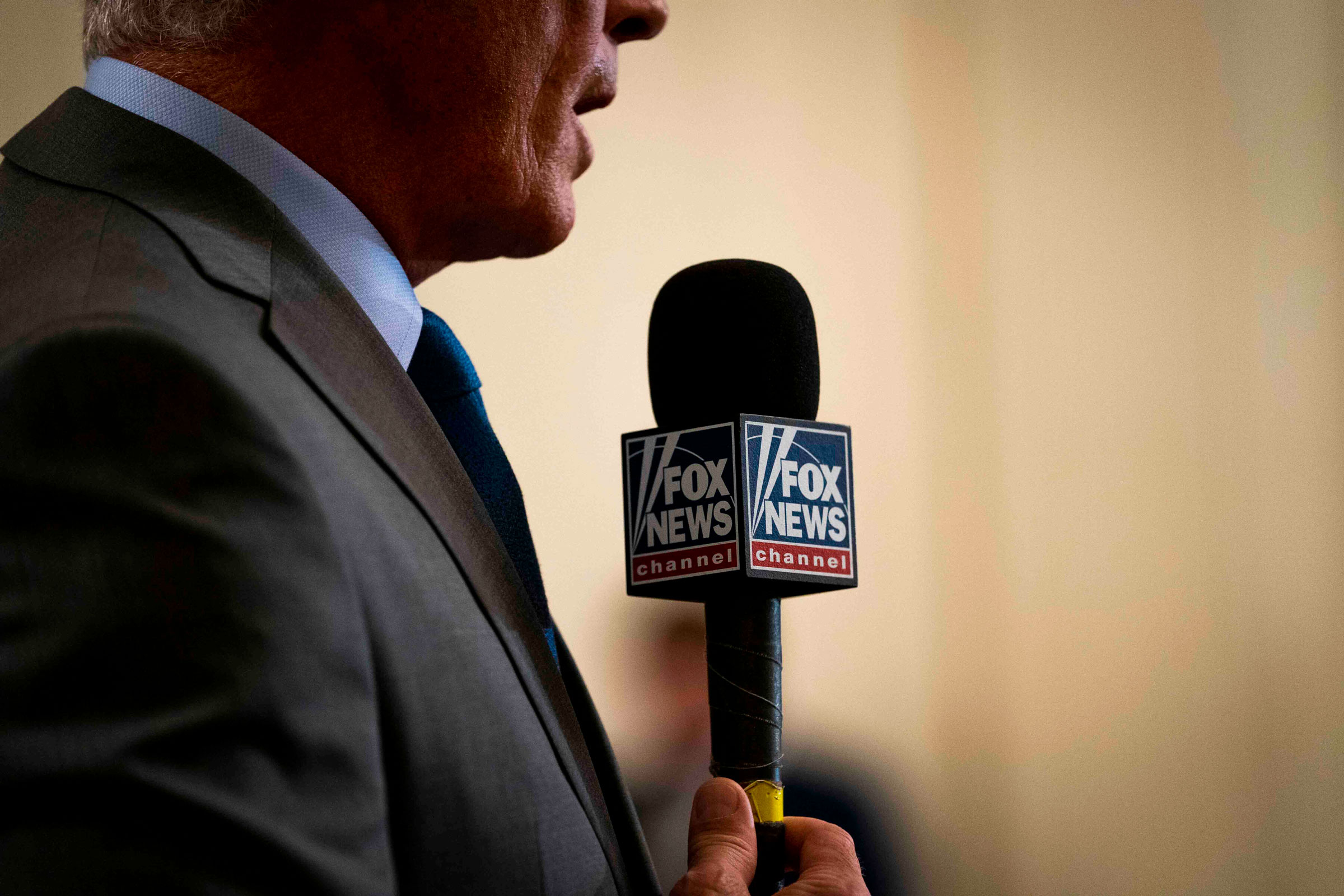 A Fox News reporter during coverage of a news conference at the White House