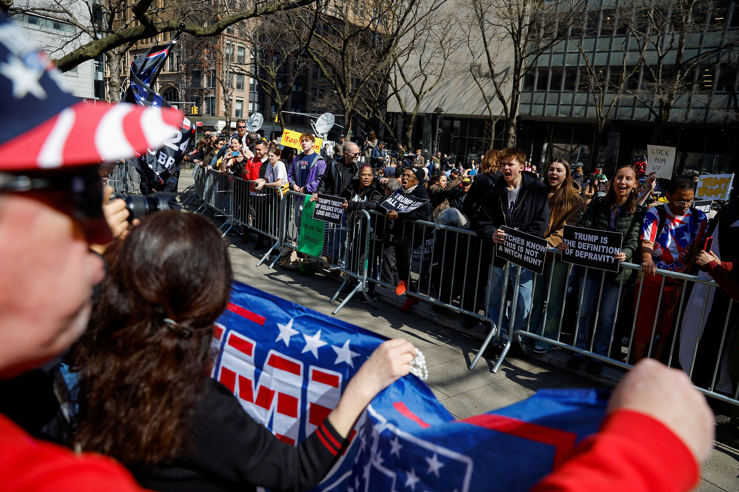 Anti-Trump protesters demonstrate facing Trump supporters outside Manhattan Criminal Courthouse in New York City, on April 4, 2023. (Amanda Perobelli—Reuters)