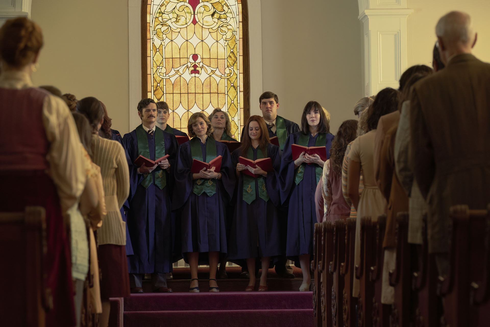 A church choir singing in front of a congregation