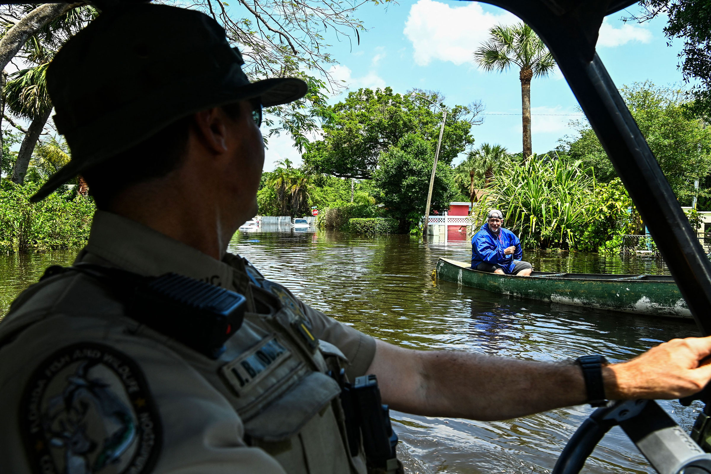 Lieutenant James Brodbeck of Florida Fish and Wildlife Conservation law enforcement patrols through the flooded neighborhood after heavy rain in Fort Lauderdale, Fla., on April 13, 2023. (Chandan Khanna—AFP/Getty Images)