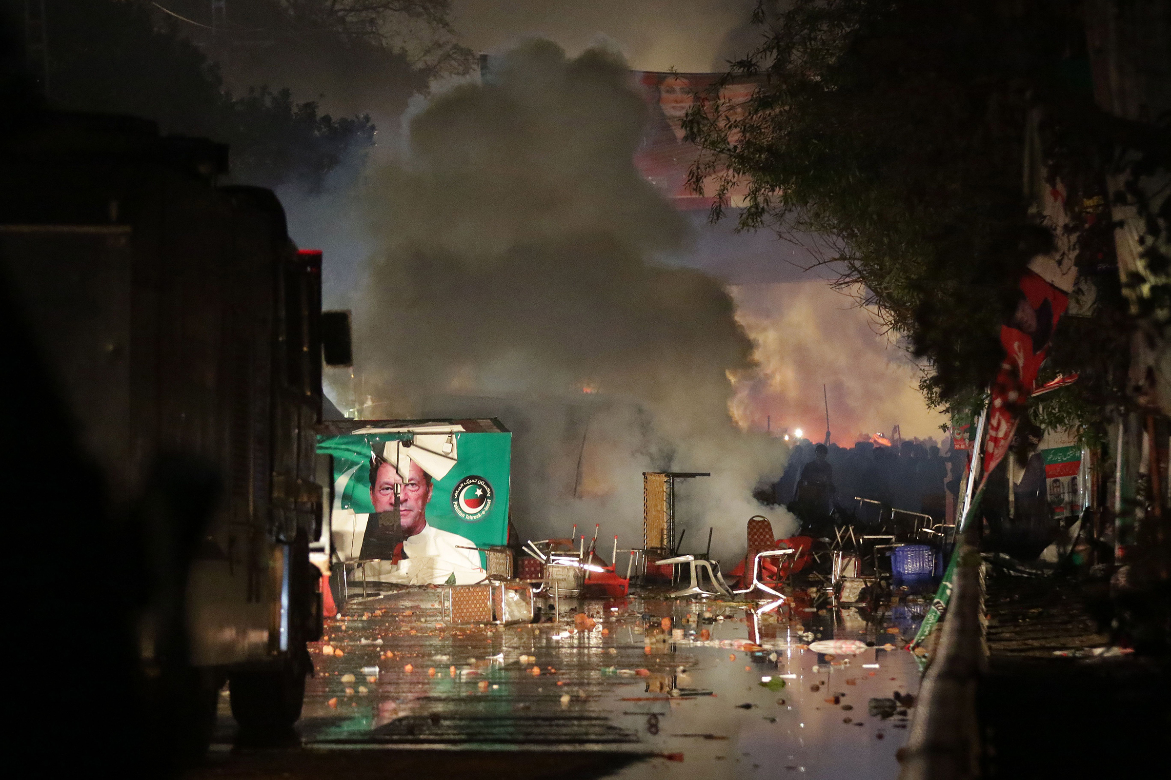 Police fired teargas to disperse the supporters of the former Prime Minister as they tried to arrest Khan in Lahore, Pakistan, on March 14. Hundreds of Tehrik-e-Insaf supporters clashed with riot police as they reached Khan's residence. (Rahat Dar—EPA-EFE/Shutterstock)