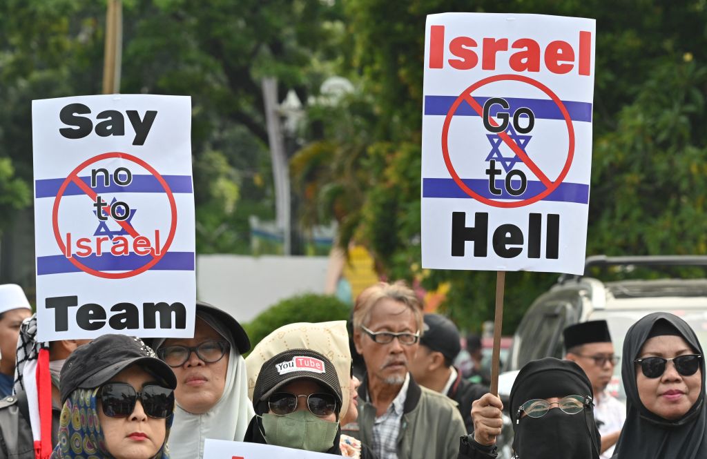 Indonesians protest against Israel's participation in the Under-20 World Cup in Jakarta on March 20, 2023.  (Adec Berry-AFP / Getty Images)