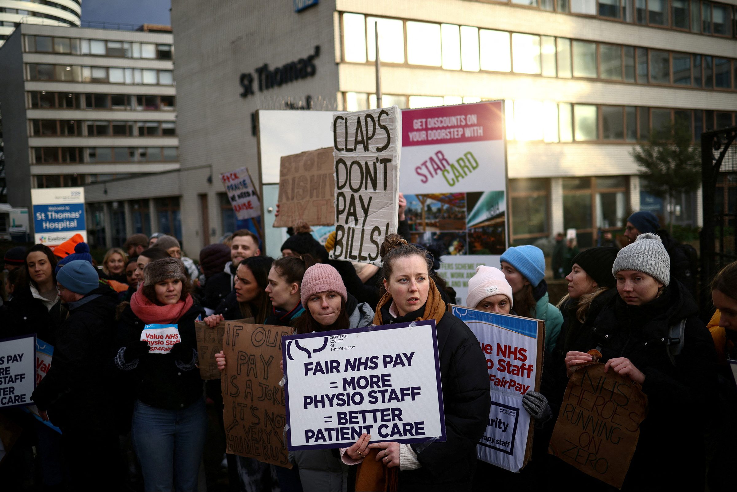 NHS physiotherapists stand at a picket line as they strike outside St Thomas' Hospital in London on Jan. 26, 2023. (Henry Nicholls—Reuters)