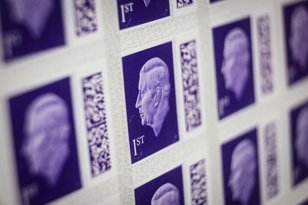 A sheet of the new first class stamps featuring a likeness of King Charles III is seen in a display case at the Royal Mail Museum on Feb. 08, 2023 in London. (Leon Neal—Getty Images)