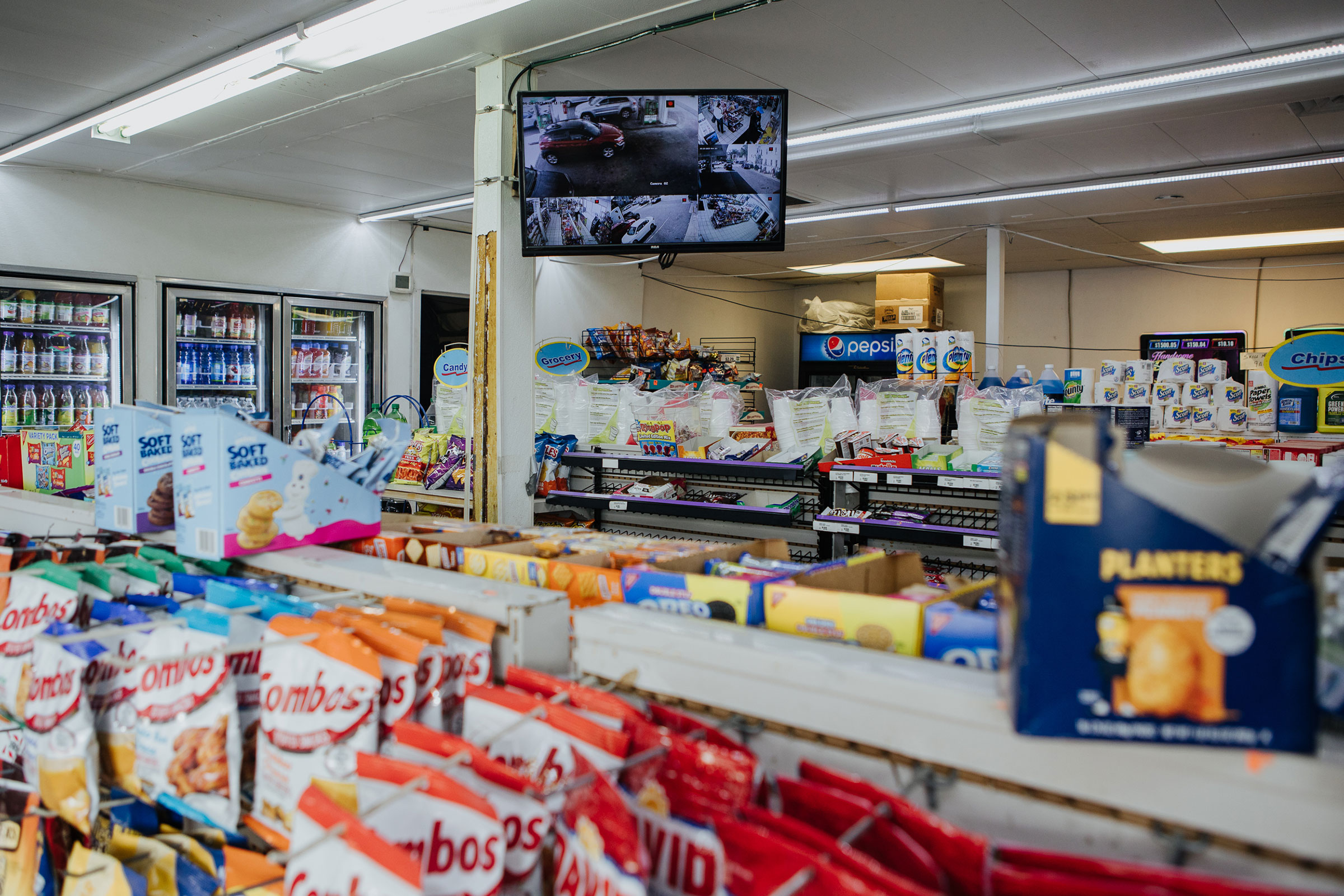 A view into the Karco gas station with a surveillance feed is seen in North Philadelphia, Pa. on April 24, 2023. (Michelle Gustafson for TIME)