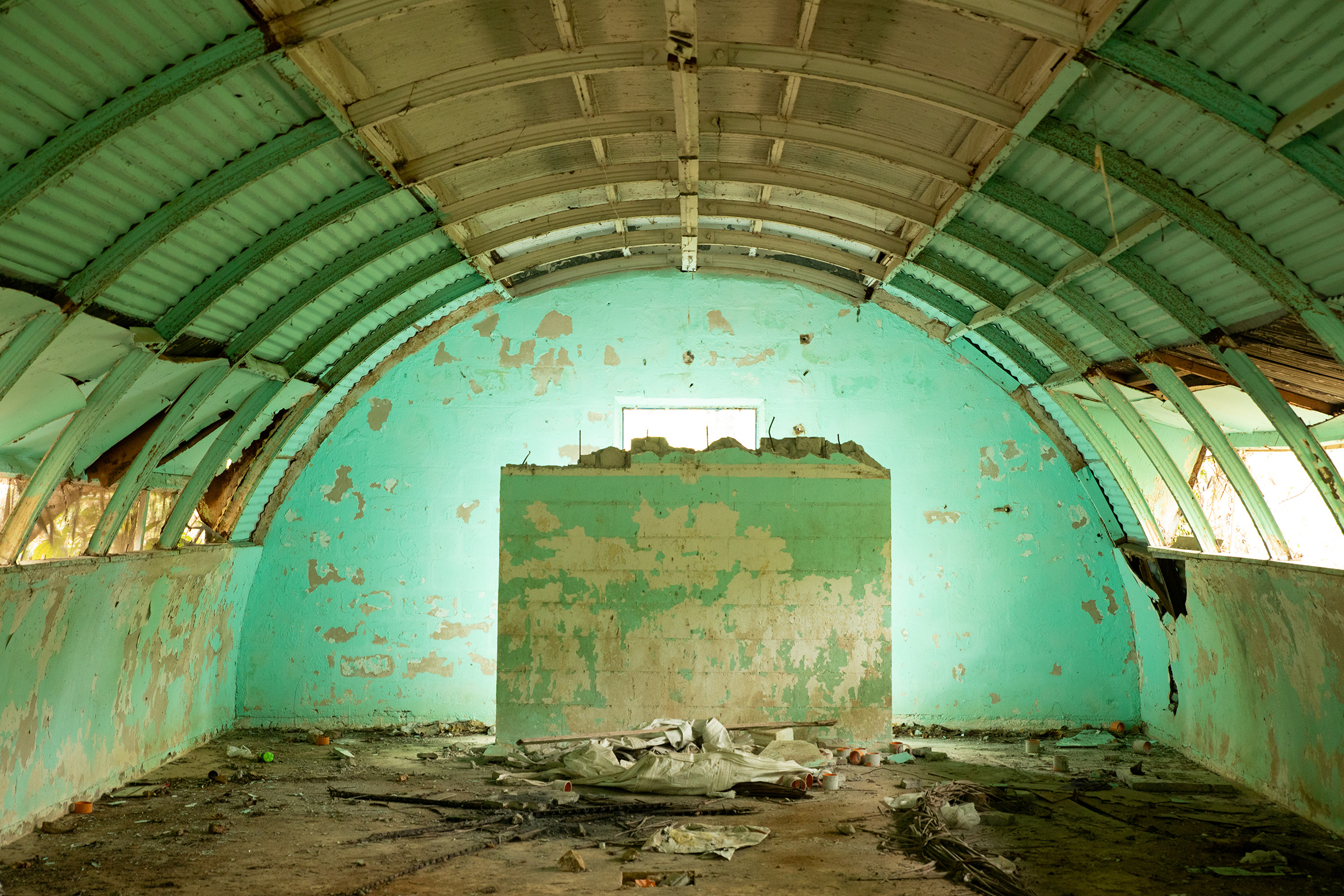 Inside one of the Quonset huts, which were used as barracks before being abandoned by the U.S. military, in Subic Bay. (Geric Cruz for TIME)