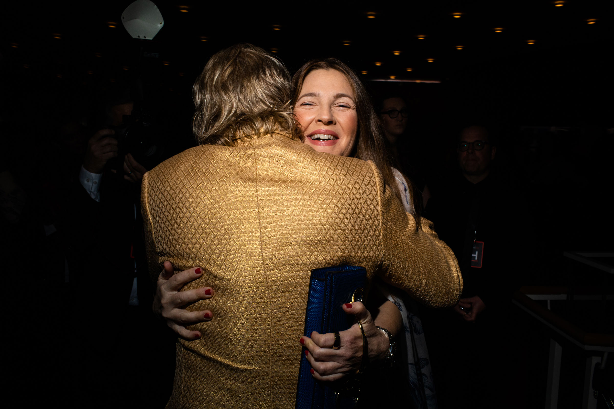 Drew Barrymore hugs activist, journalist and lawyer, Ronan Farrow at the TIME 100 Gala at Jazz at Lincoln Center in New York City, on April 26, 2023. (Landon Nordeman for TIME)