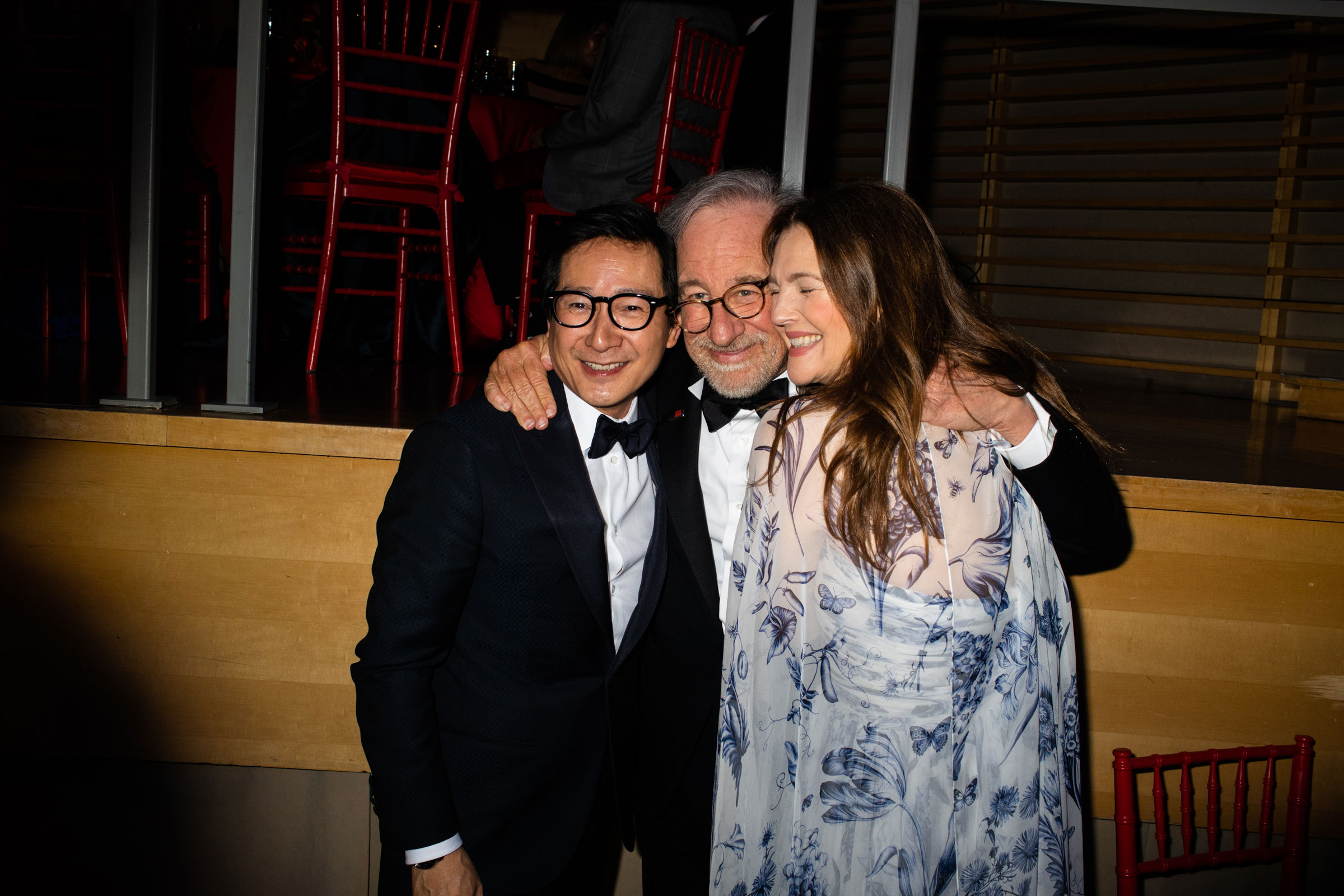 Ke Huy Quan, Steven Spielberg, and Drew Barrymore embrace during the TIME 100 Gala at Jazz at Lincoln Center in New York City, on April 26, 2023. (Landon Nordeman for TIME)