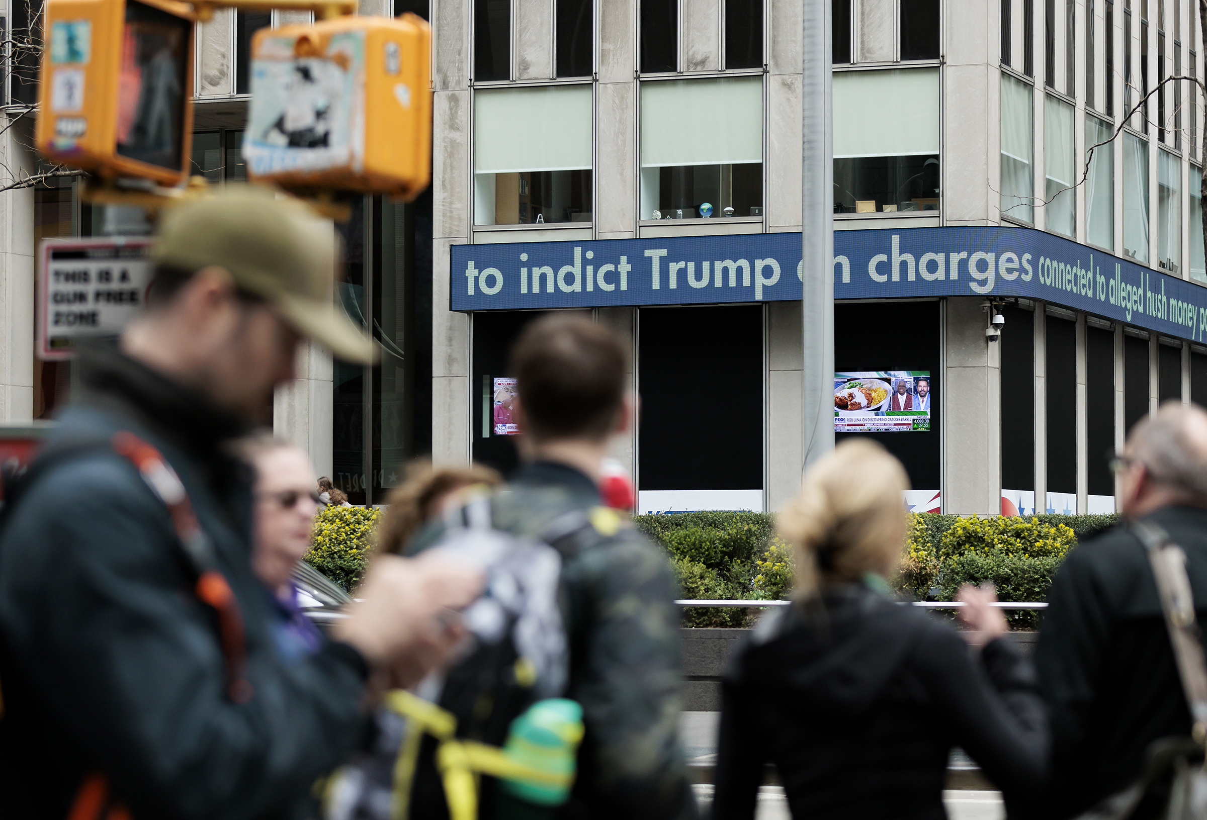 A news headline ticker shows information about the indictment of former President Donald J. Trump by a Manhattan grand jury in New York City on March 31. (Justin Lane—EPA-EFE/Shutterstock)