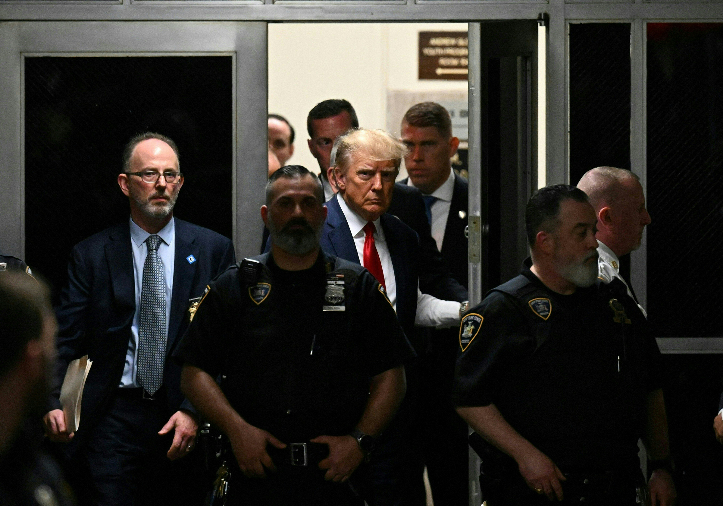 Former President Trump makes his way inside the Manhattan Criminal Courthouse in New York on April 4. (Ed Jones—AFP/Getty Images)