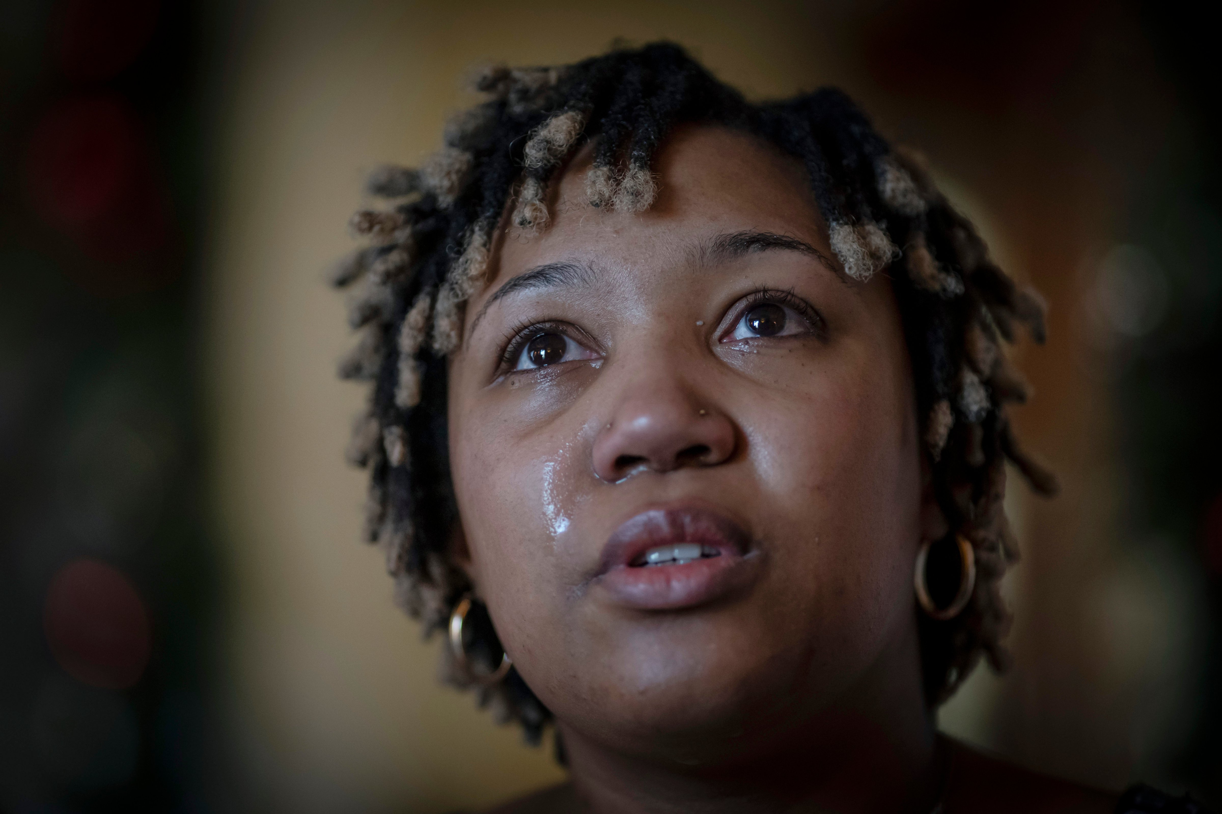 Angelica Lyons tears up while recalling her birthing experience. (Wong Maye-E—AP Photo)