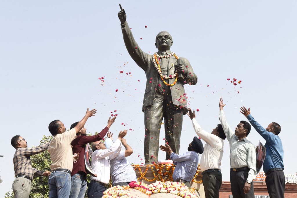 Members of All India PSB SC/ST Employees Welfare Council, pay tribute to a statue of social reformer B. R. Ambedkar on the occasion of his birth anniversary, in Amritsar on April 14, 2022. (NARINDER NANU- AFP)