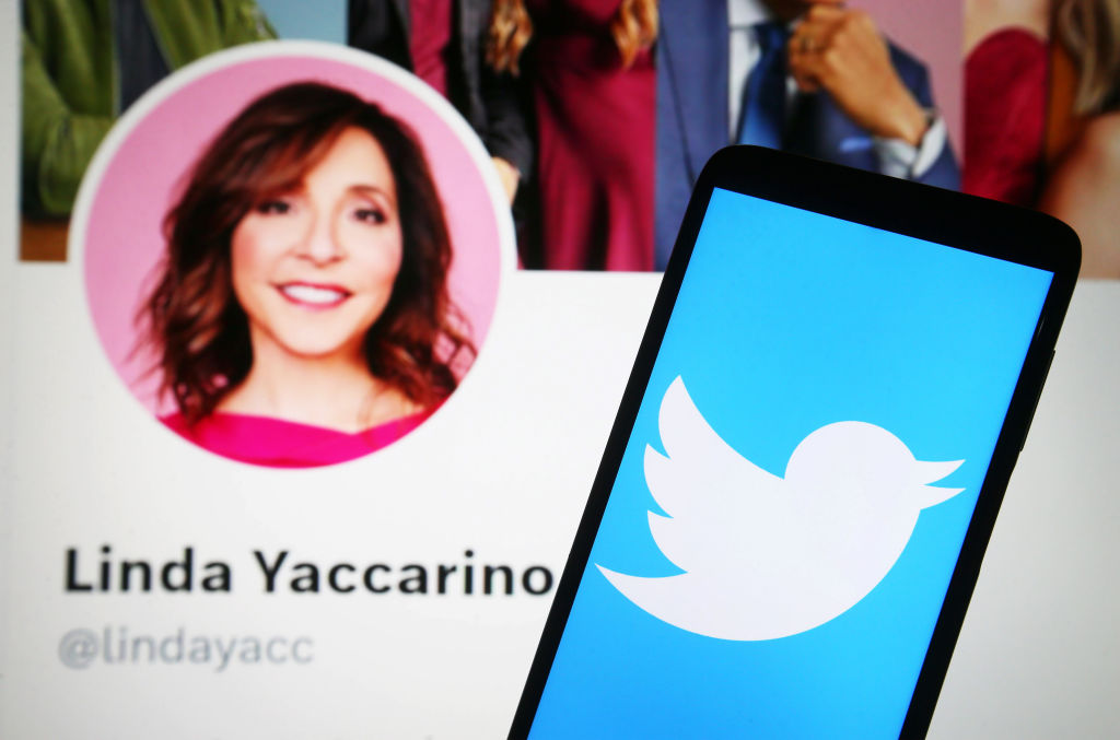 In this photo illustration, a Twitter logo is seen on a smartphone and Linda Yaccarino Twitter webpage on a PC screen. Elon Musk names Linda Yaccarino as a new Twitter CEO. (Photo Illustration by Pavlo Gonchar/SOPA Images/LightRocket via Getty Images)