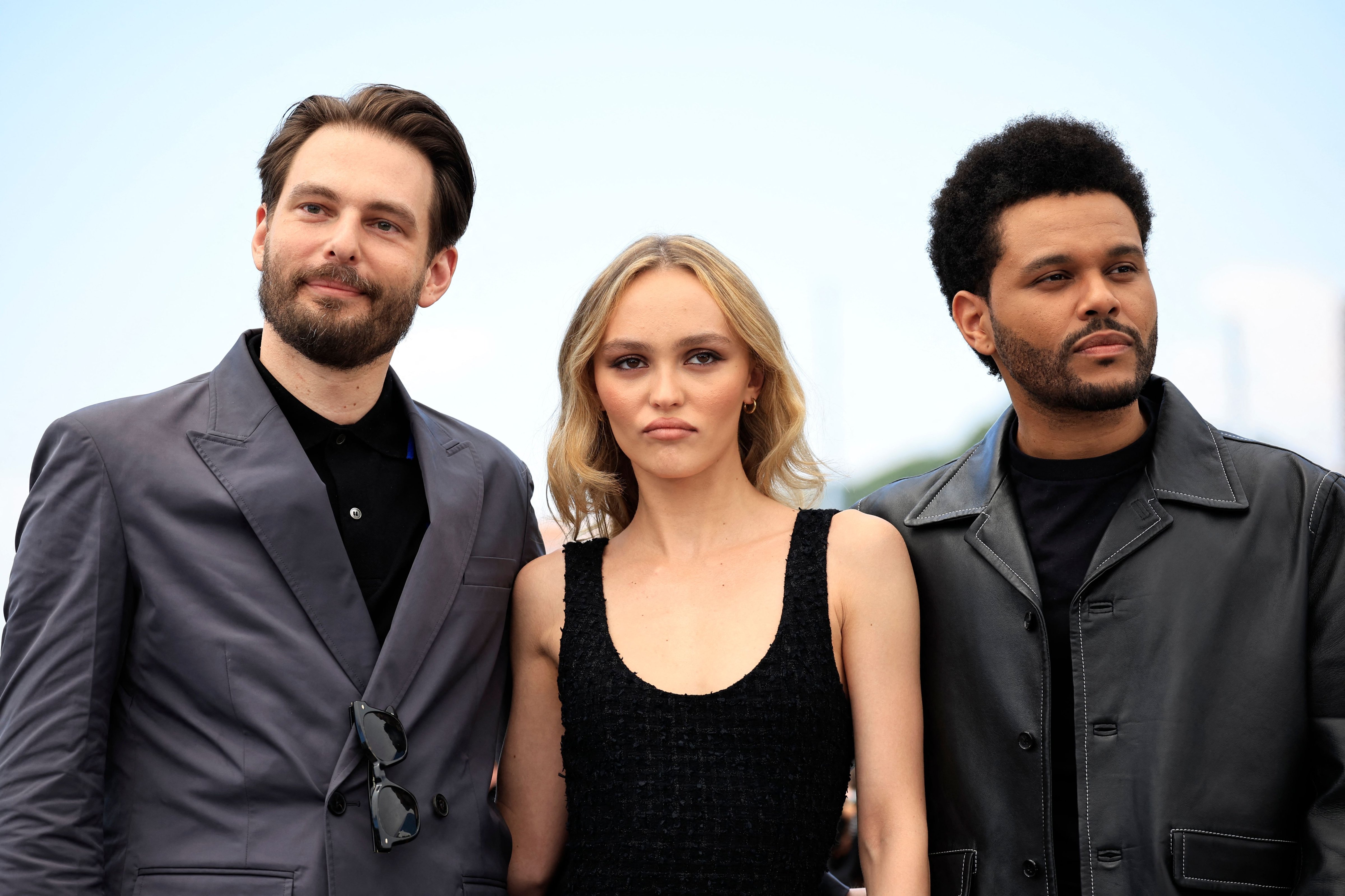 (From L) US director Sam Levinson, French-US actress Lily-Rose Depp and Canadian singer Abel Makkonen Tesfaye aka The Weeknd at the 76th edition of the Cannes Film Festival. (Photo by Valery HACHE / AFP))