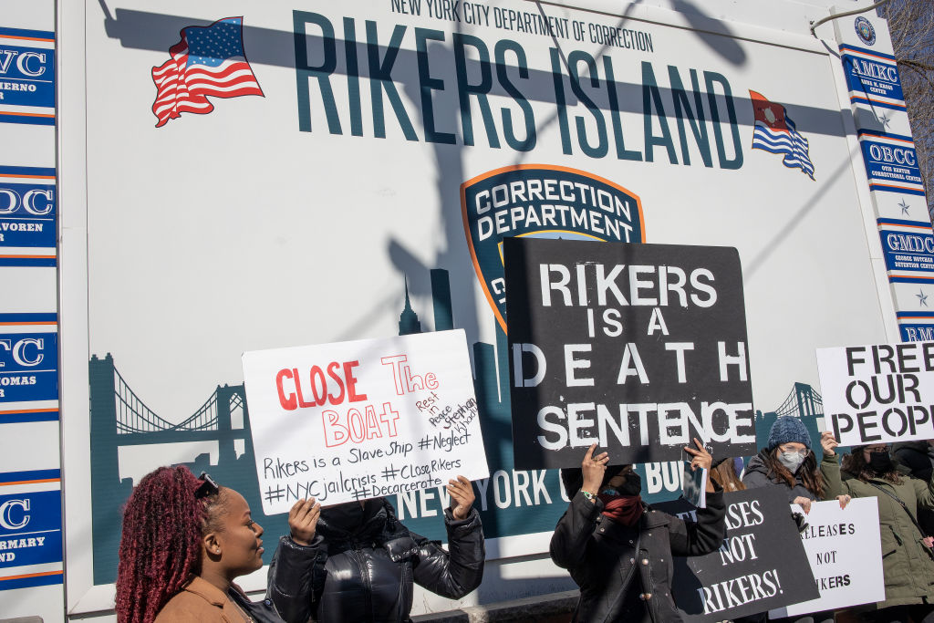 Criminal justice activists demand that Rikers Island jail and the system that discriminates against the poor by demanding bail before trial end, on February 28, 2022 at the gate to Rikers Island in Queens, New York. (Andrew Lichtenstein-Corbis)