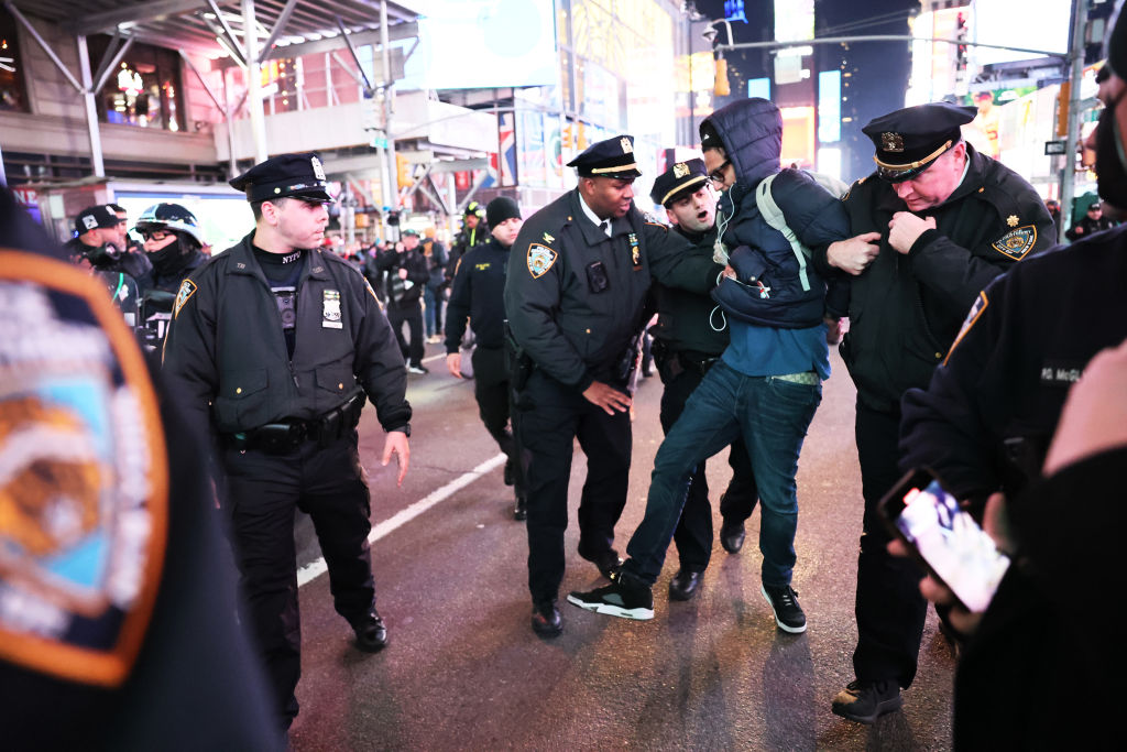 NYPD officers arrest a demonstrator as people protest the death of Tyre Nichols on January 27, 2023 in New York City. The release of a video depicting the fatal beating of Nichols, a 29-year-old Black man, sparked protests in NYC and other cities throughout the country. Nichols was violently beaten for three minutes and killed by Memphis police officers earlier this month after a traffic stop. Five Black Memphis Police officers have been fired after an internal investigation found them to be “directly responsible” for the beating and have been charged with “second-degree murder, aggravated assault, two charges of aggravated kidnapping, two charges of official misconduct and one charge of official oppression.” (Michael M. Santiago-Getty Images)
