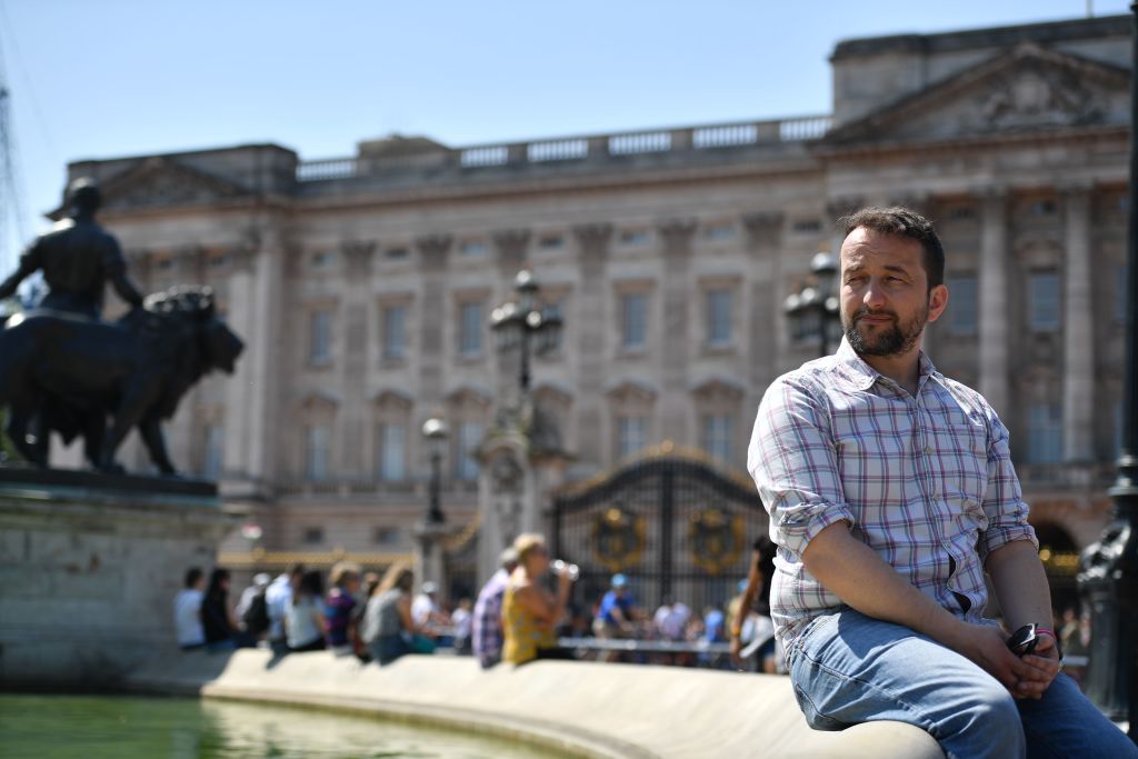 Graham Smith, CEO of Republic, a British republican pressure group, poses for a photograph outside Buckingham Palace in central London on May 8, 2018. (Ben Stansall—AFP via Getty Images)