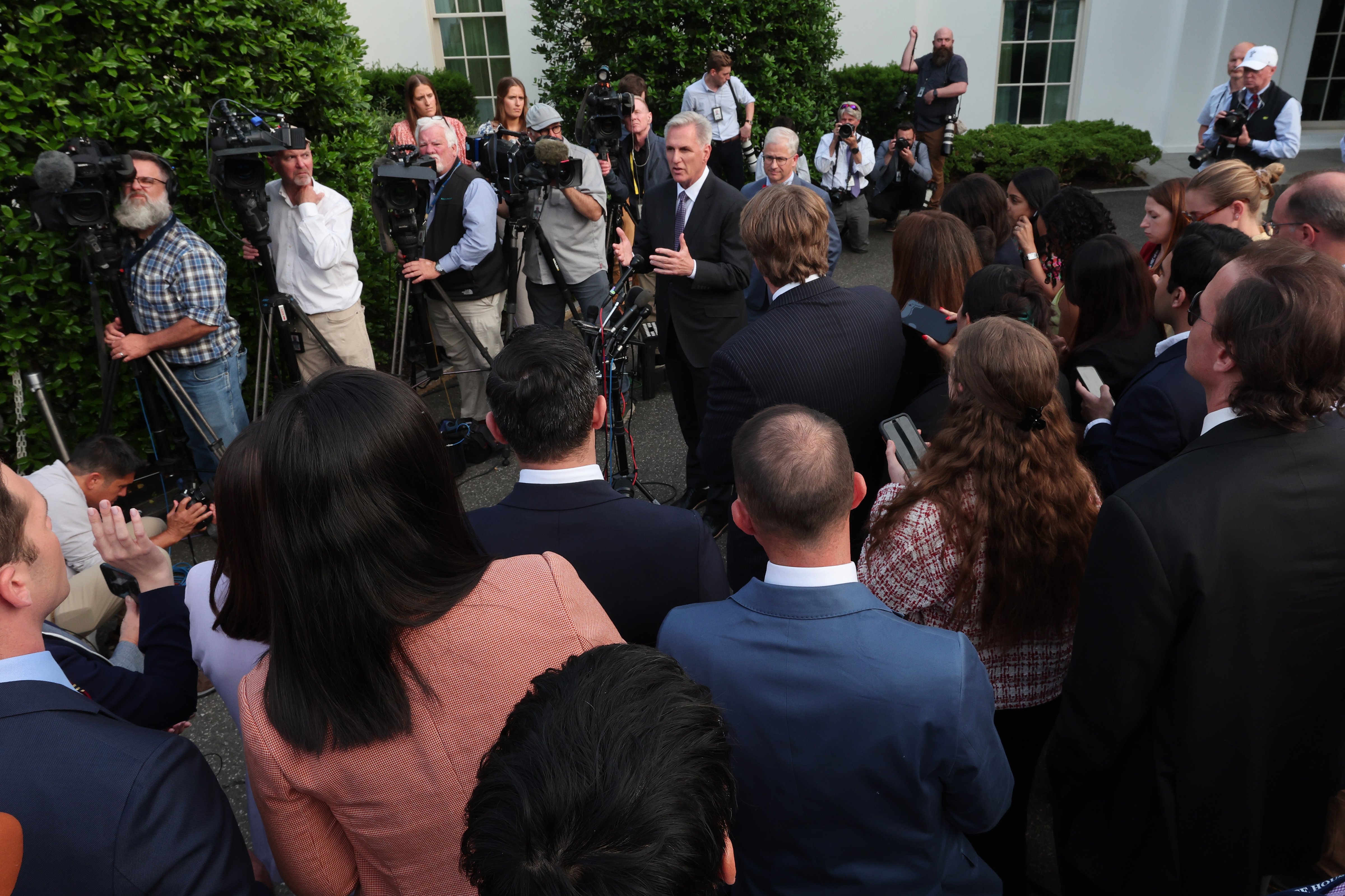 US Speaker of the House Kevin McCarthy (R-CA), joined by Rep. Patrick McHenry (R-NC), speaks to reporters after his meeting with US President Joe Biden at the White House on May 22, 2023.  (Alex Wong - Getty Images)