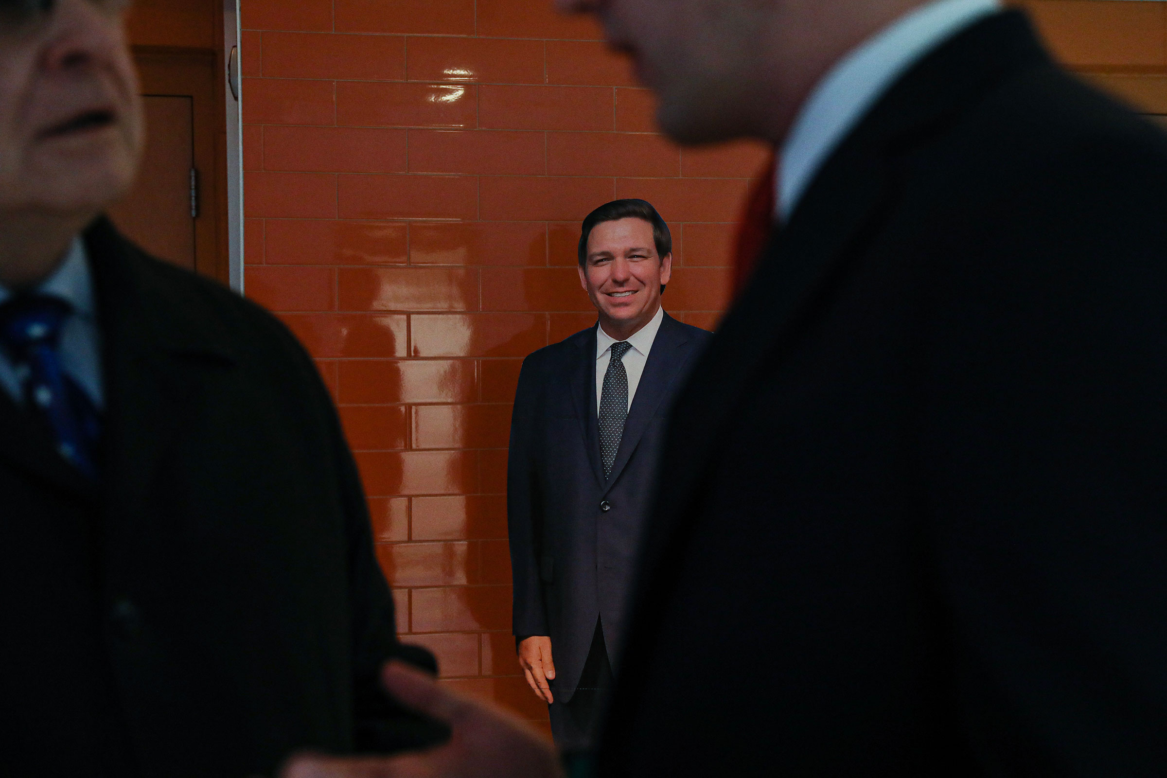 A cardboard cutout of DeSantis stands against a wall at the New Hampshire Republican State Committee fundraiser on Jan. 28