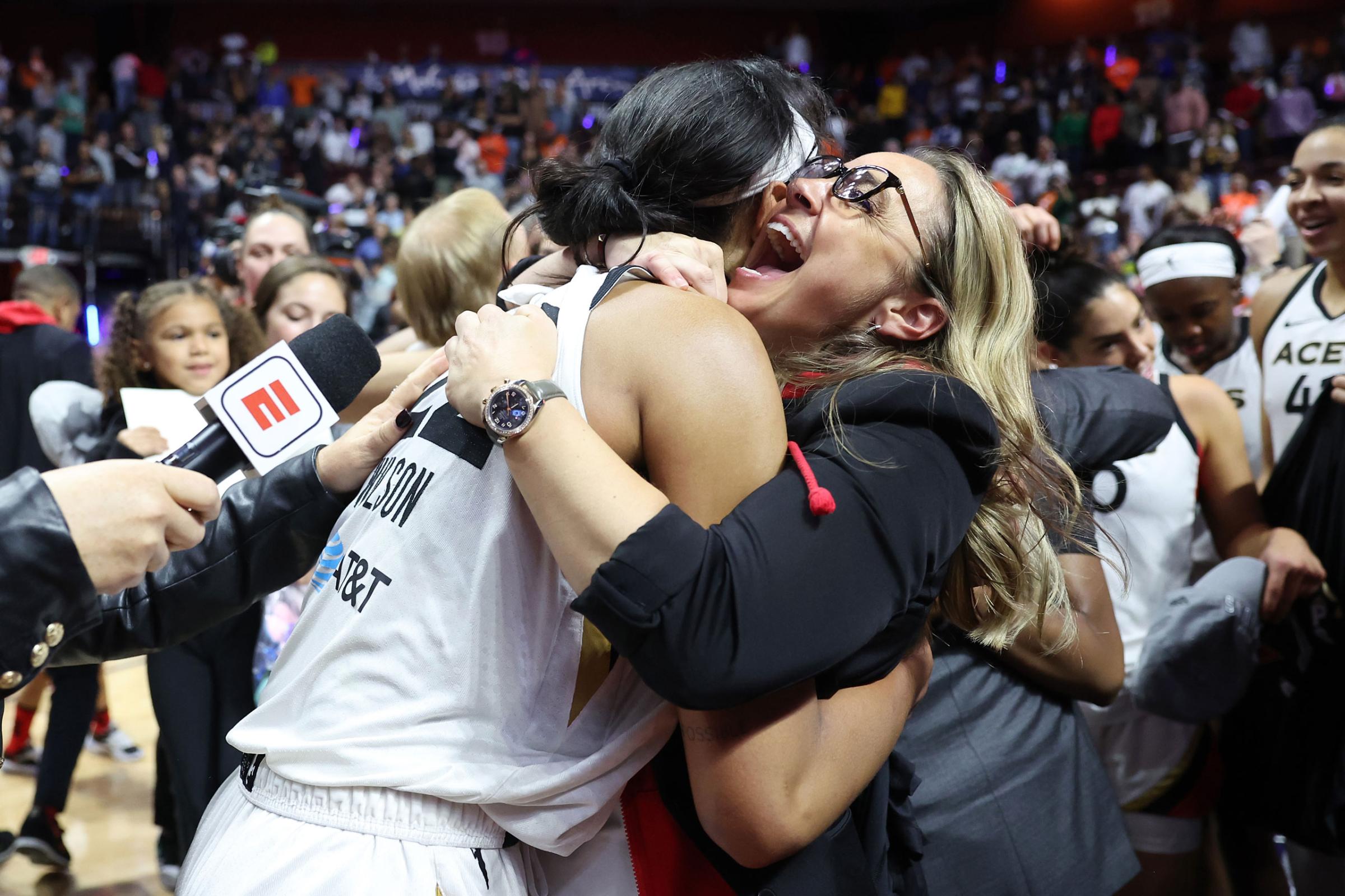 A'ja Wilson of the Las Vegas Aces celebrates with head coach Becky Hammon after defeating the Connecticut Sun in game four to win the 2022 WNBA Finals.