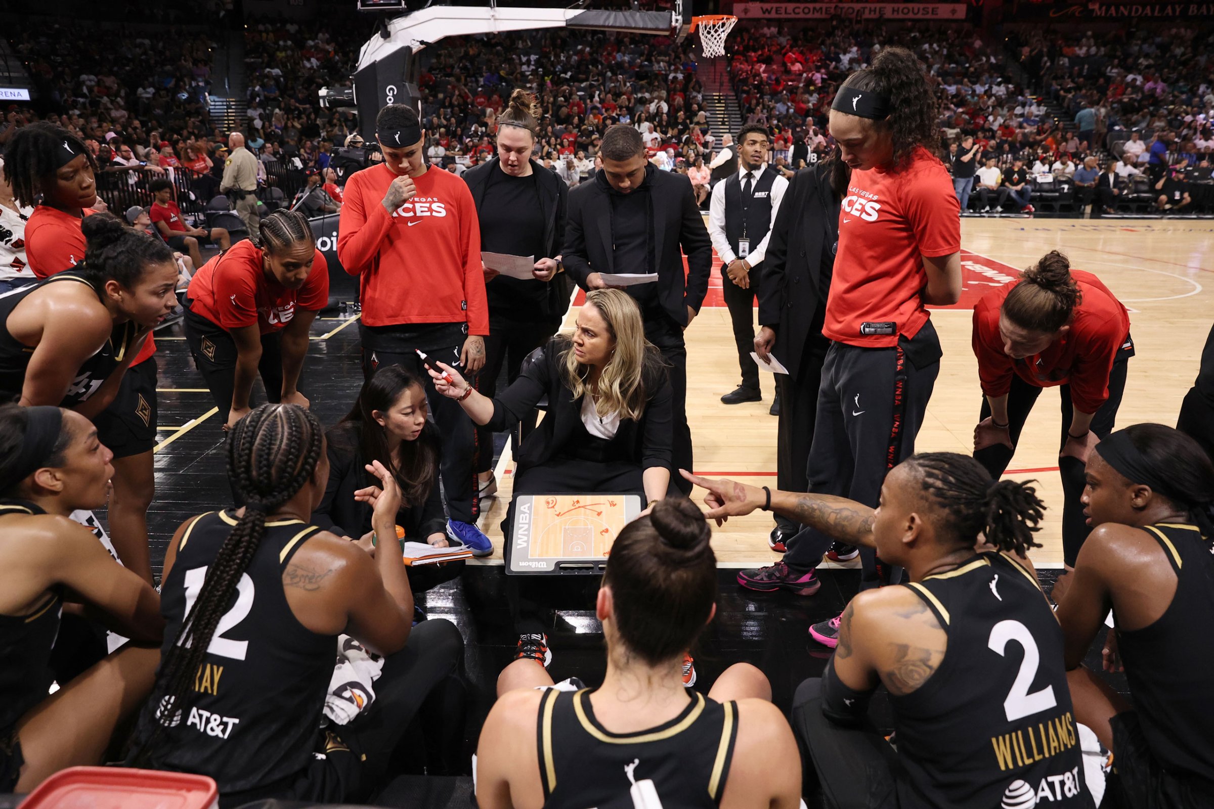 Las Vegas Aces head coach Becky Hammon leads a huddle during Game 2 in the second round of the 2022 WNBA Playoffs