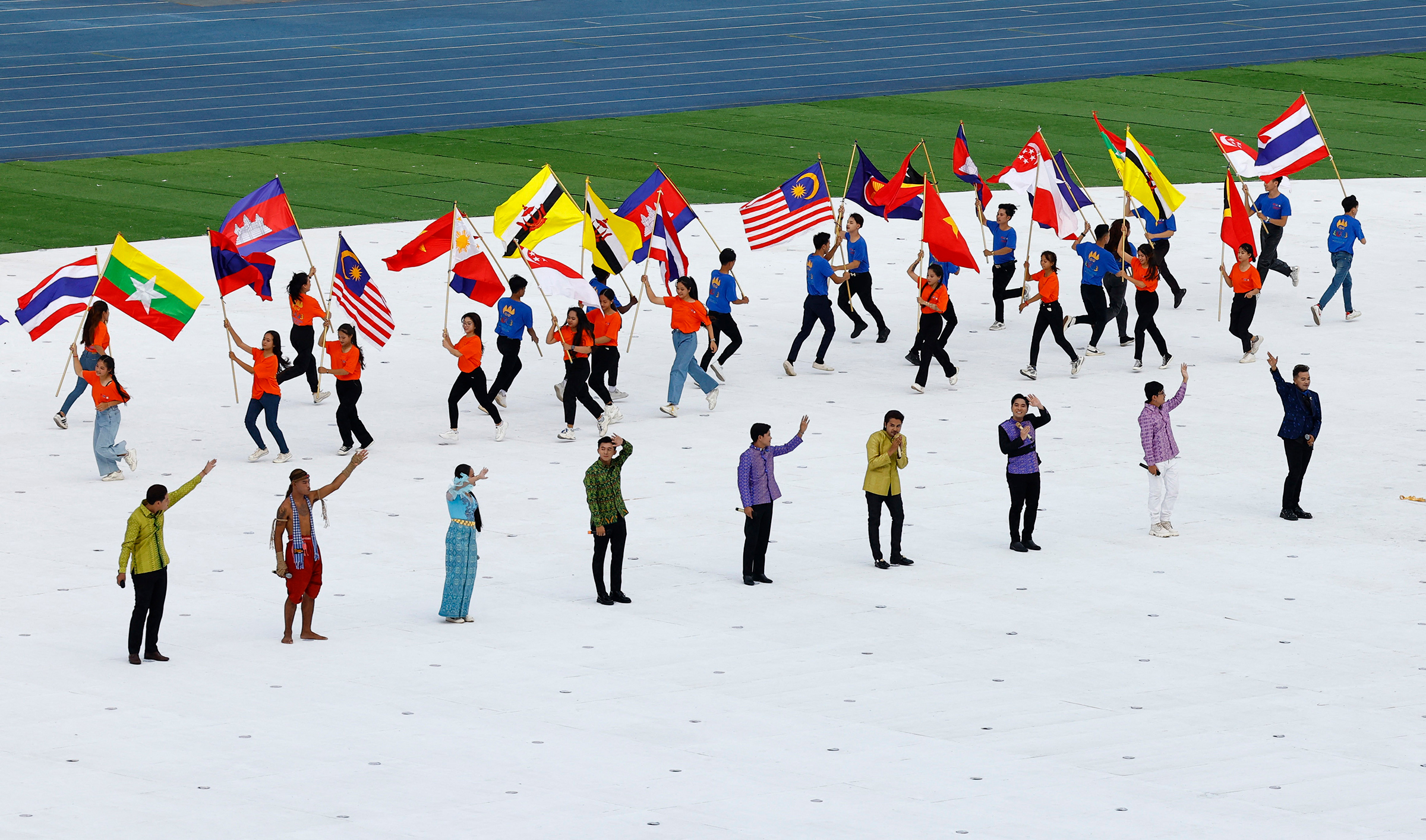 Performers carrying flags of participating nations during the opening ceremony of the 2023 Southeast Asia (SEA) Games at Morodok Techo National Stadium in Phnom Penh, Cambodia, May 5, 2023. (Kim Kyung-Hoon—Reuters)