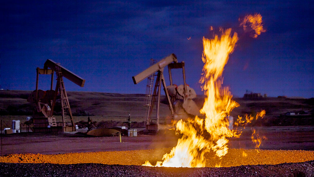 Flames from a flaring pit near a well in the Bakken Oil Field. The primary component of natural gas is methane, which is odorless when it comes directly out of the gas well. (Orjan F. Ellingvag/Corbis—Getty Images)