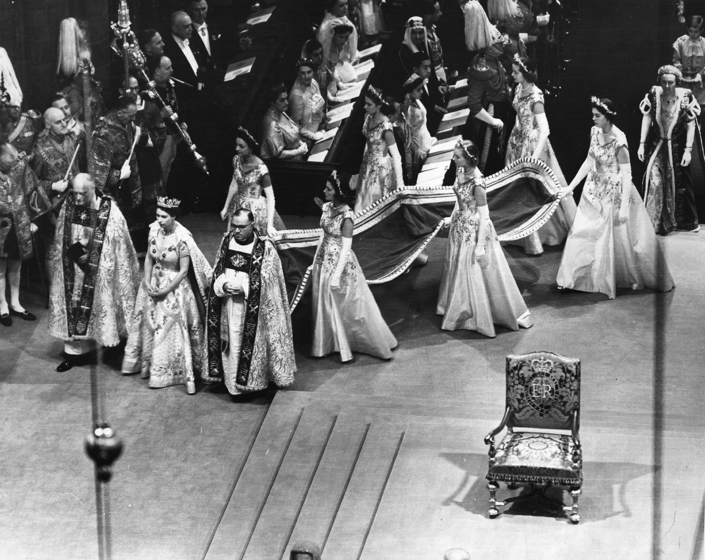 The Queen and her retinue, who are carrying her train, at her coronation. (Hulton Archive/Getty Images)