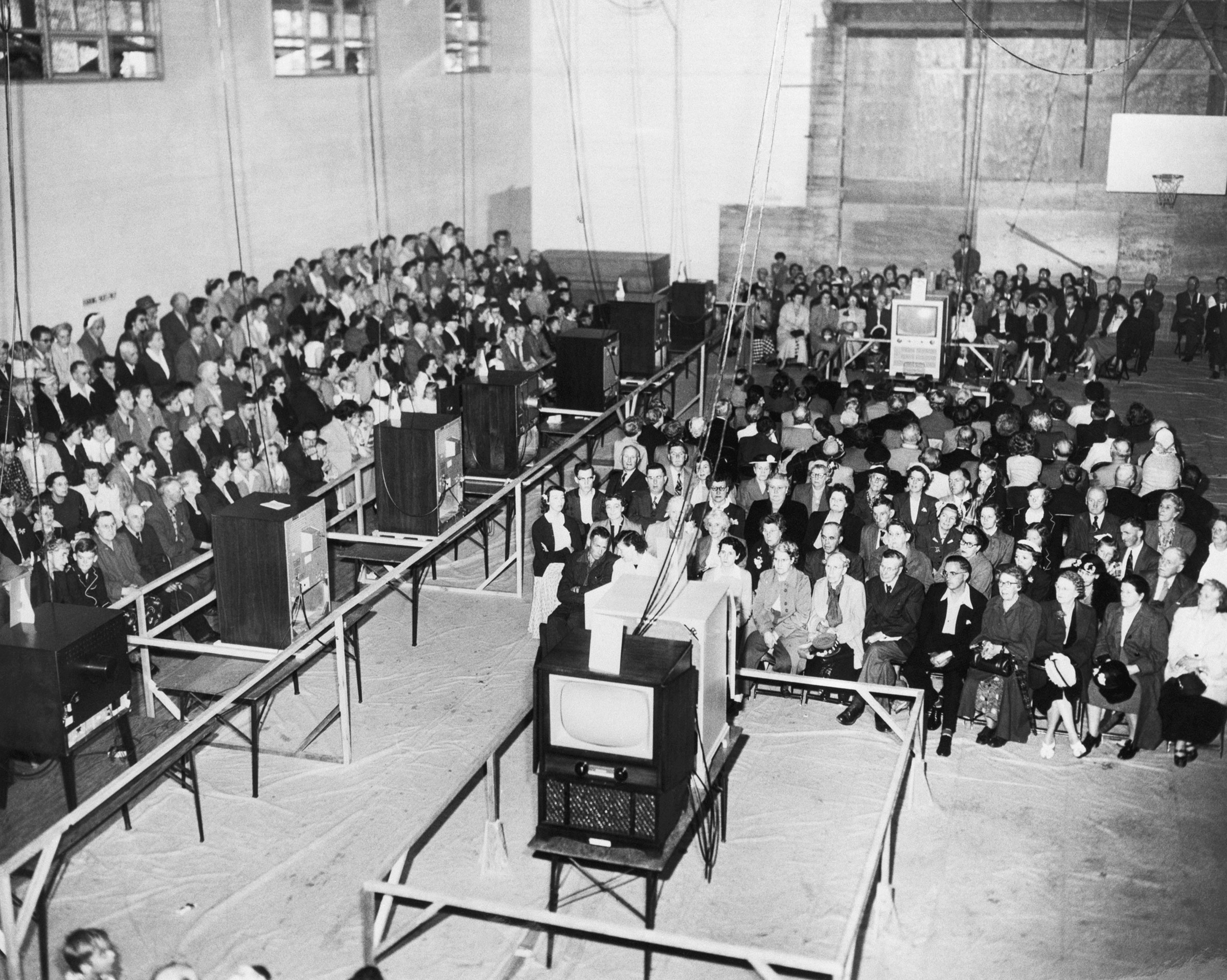 A TV hook-up in Marpole Community Centre, Vancouver allows over 1200 people to see the coronation of Queen Elizabeth II as televised from London. (Bettmann Archive/Getty Images)