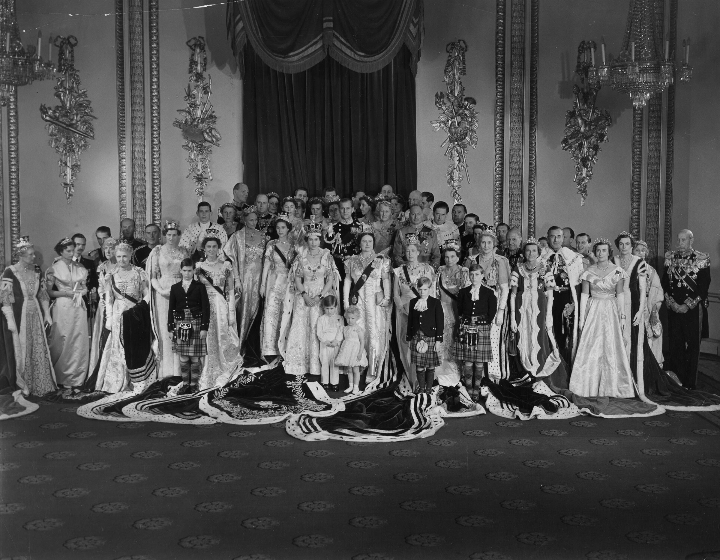 Queen Elizabeth II with Prince Philip, Duke of Edinburgh, Queen Elizabeth The Queen Mother, Princess Margaret Rose and members of the immediate and extended Royal Family, as well as foreign dignitaries, after her Coronation ceremony. (Central Press/Getty Images)