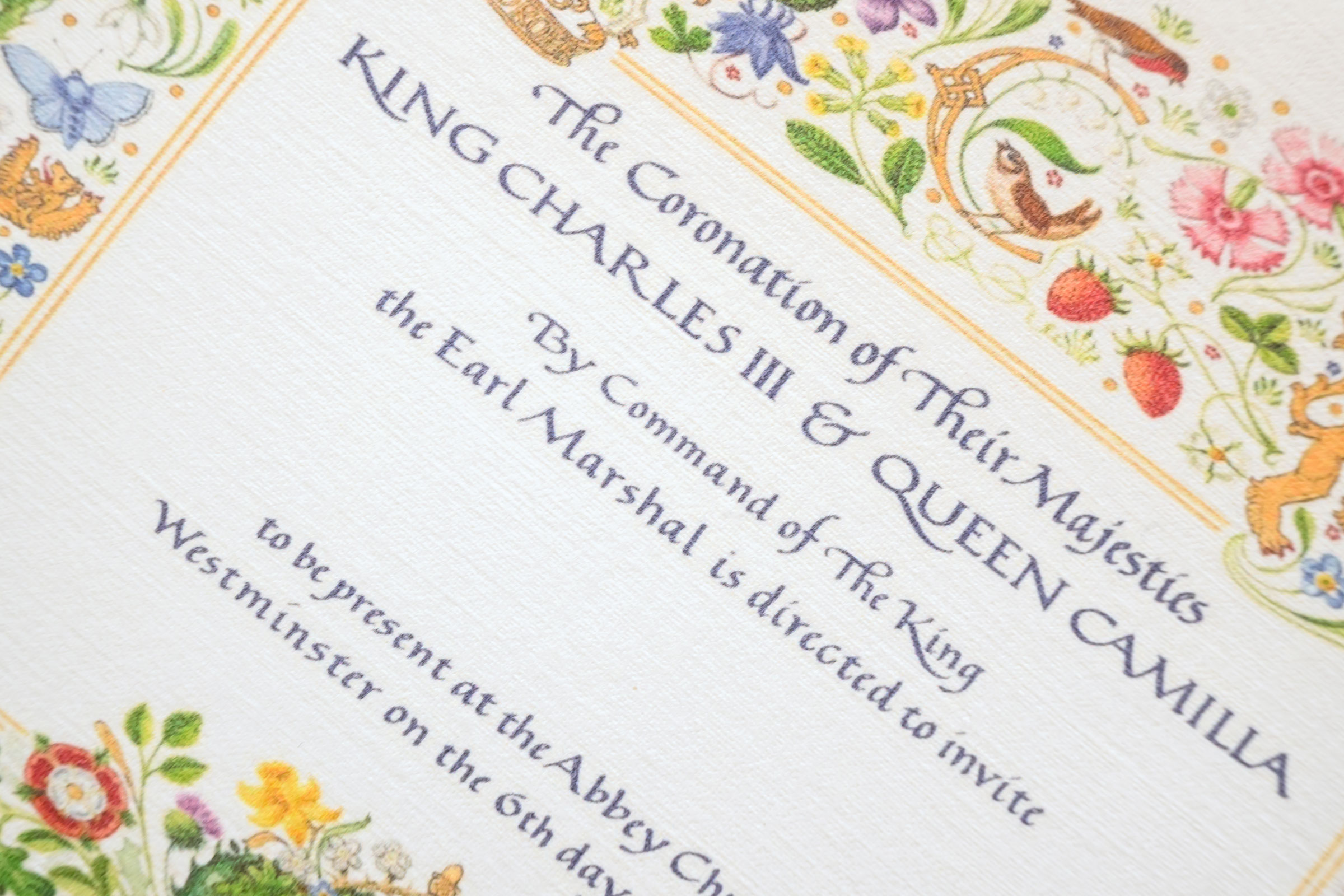 A souvenir replica invitation marking the Coronation of King Charles III. (Leon Neal—Getty Images)