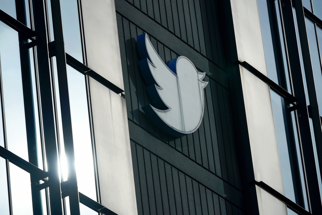 A Twitter logo hangs outside the company's offices in San Francisco, Dec. 19, 2022. (Jeff Chiu—AP)