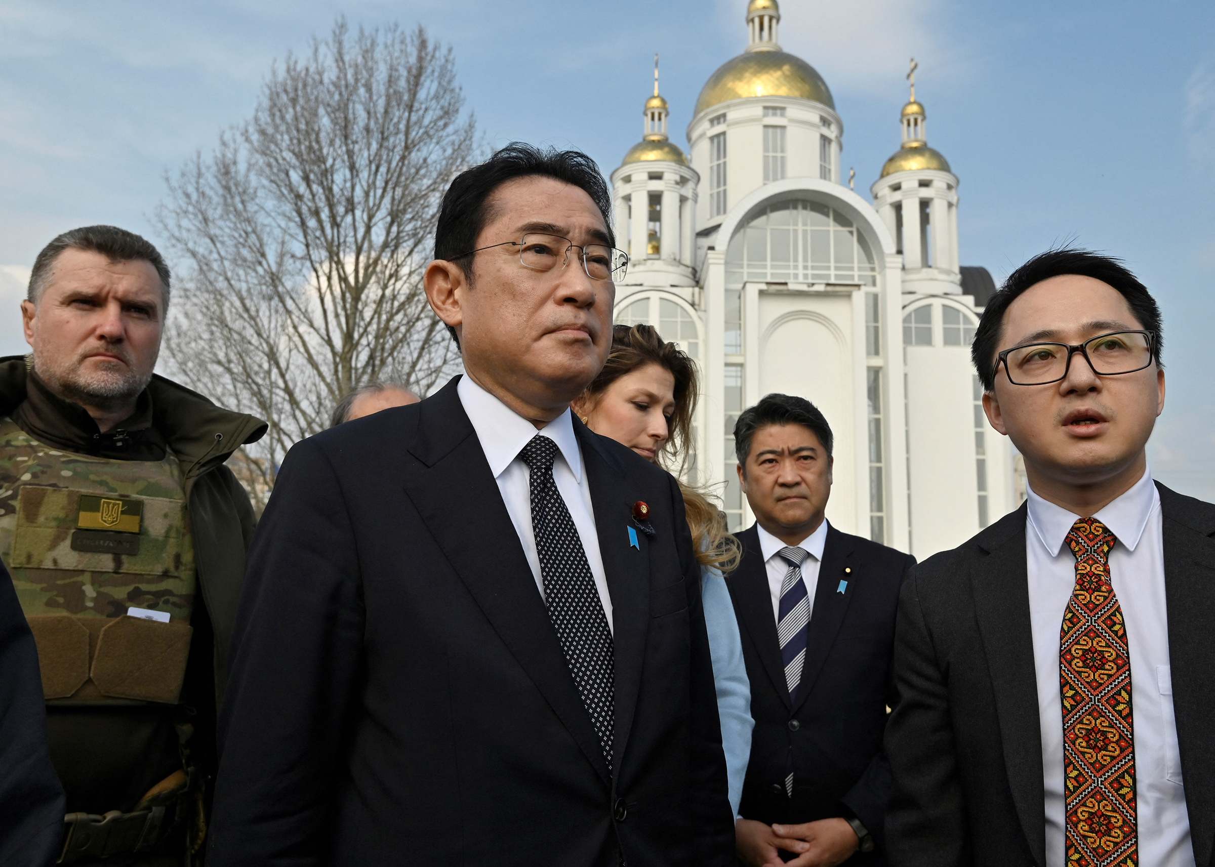 Kishida visits a mass grave site discovered at Church of St. Andrew and Pyervozvannoho All Saints in Bucha, Ukraine, on March 21. (Sergei Chuzavkov—AFP/Getty Images)