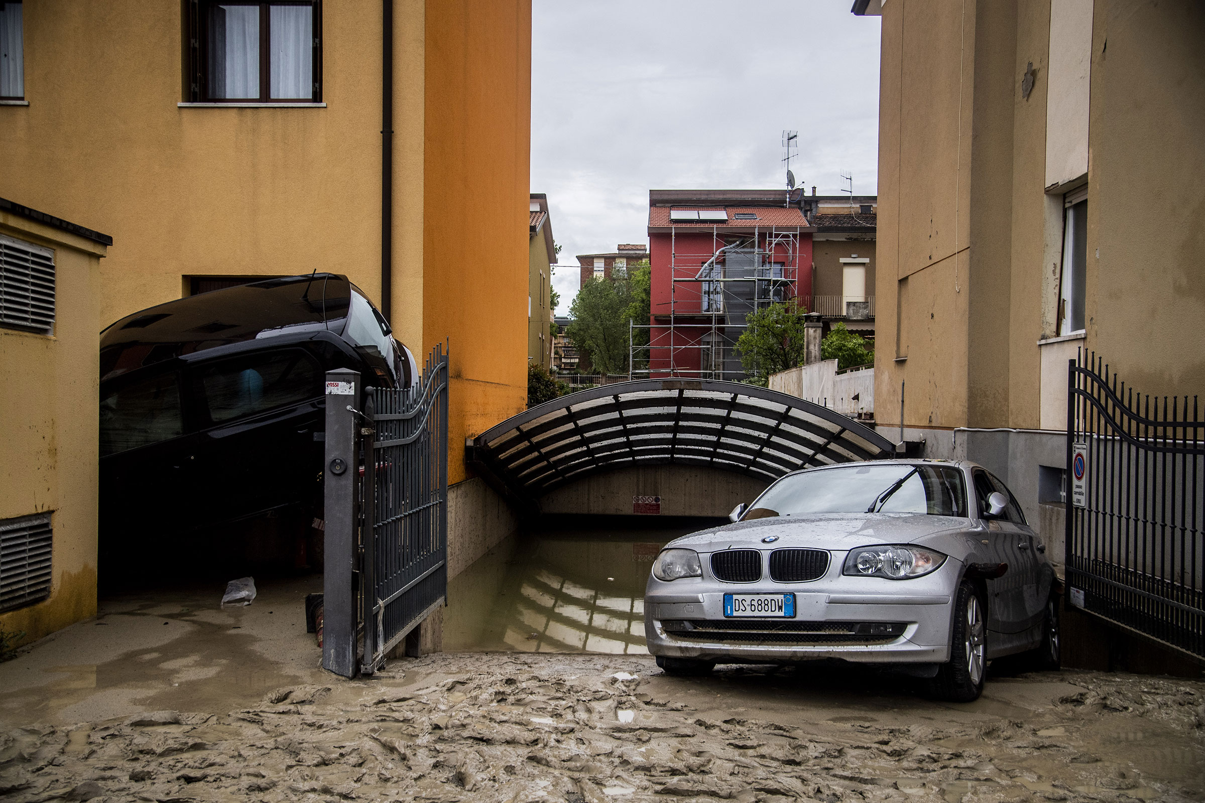 Cars displaced by the flooding of the Savio river in Cesena on May 17. (Alessandro Serrano—AGF/Shutterstock)